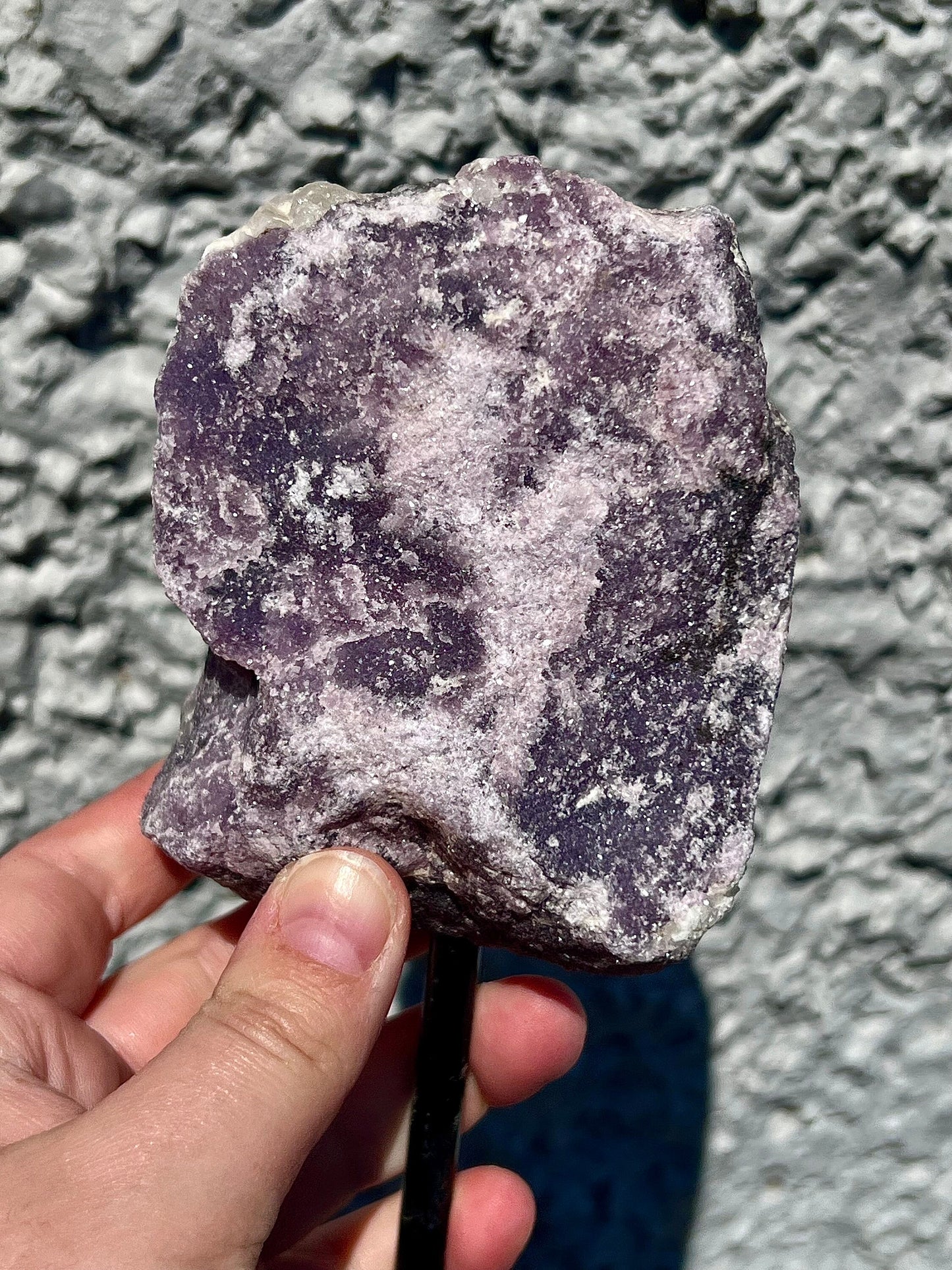 Rough lepidolite on stand