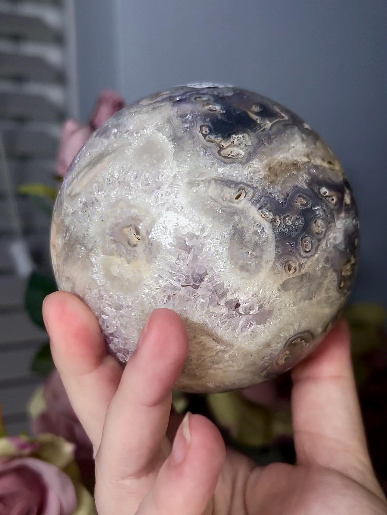 large, statement pink amethyst sphere with rutile formations and agate byover 1.220kg