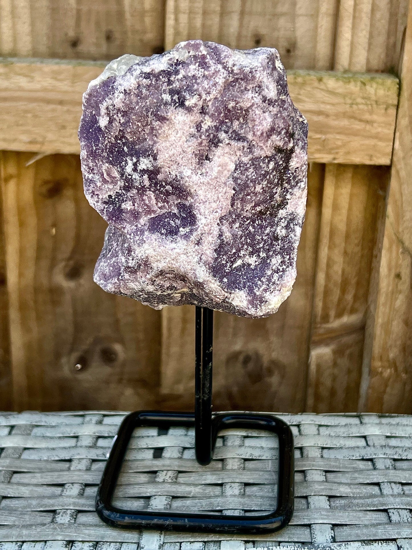 Rough lepidolite on stand