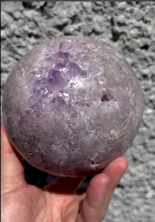 large, statement pink amethyst sphere with rutile formations in gorgeous lilac tones 2.058kg