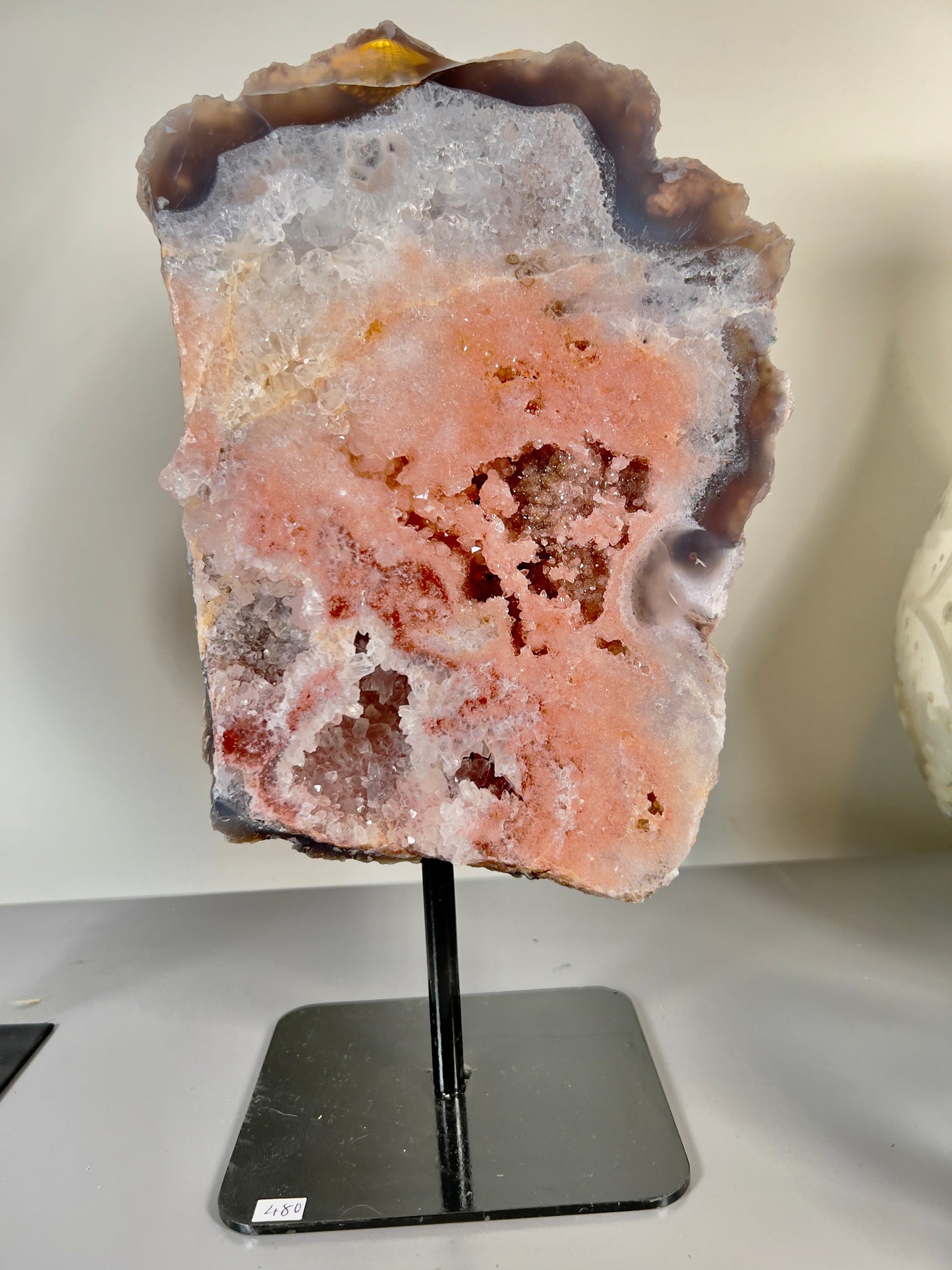 Peach, pink amethyst slab on stand  with smoky, clear and red crystallisation