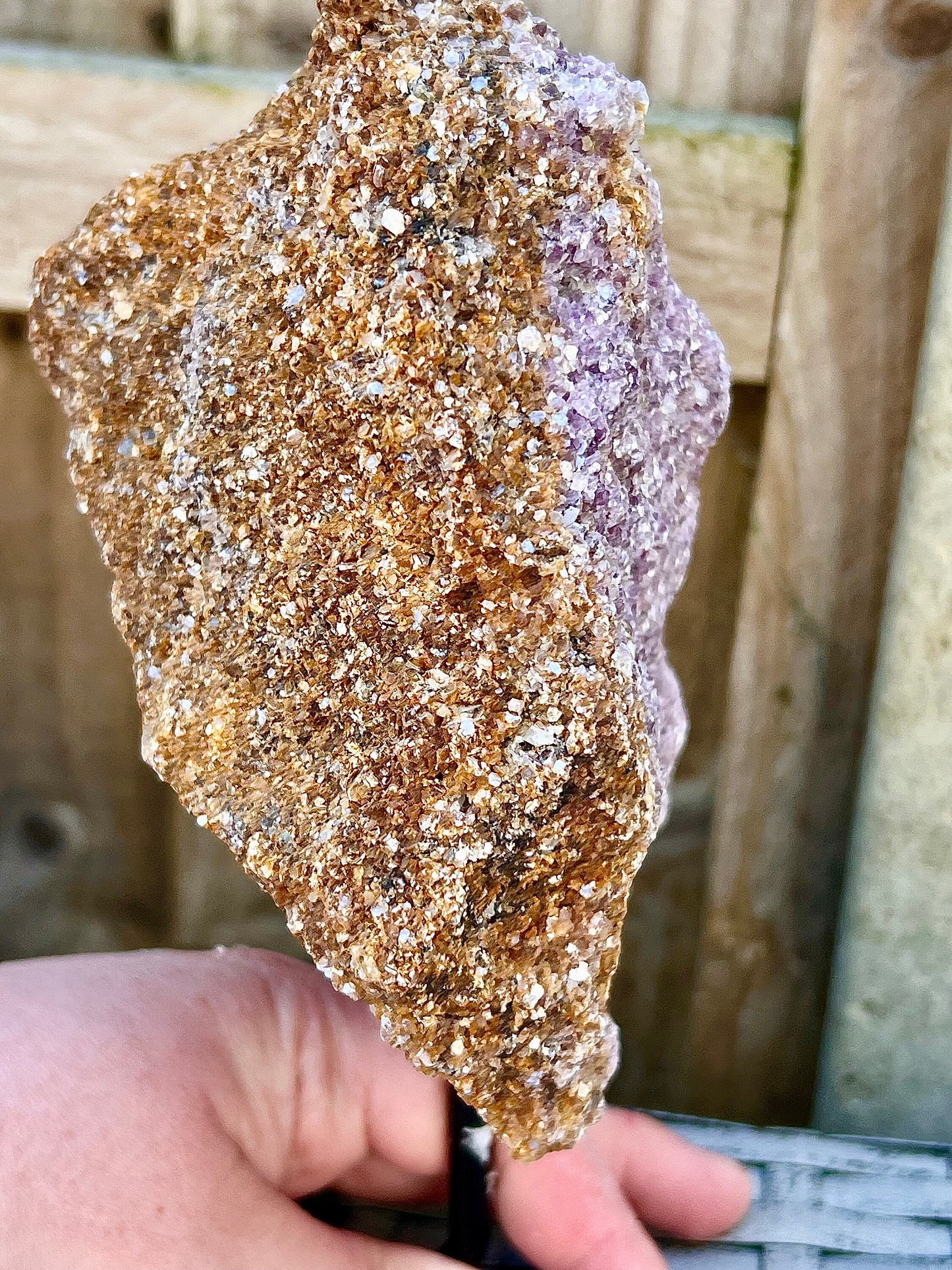 Rough lepidolite on stand