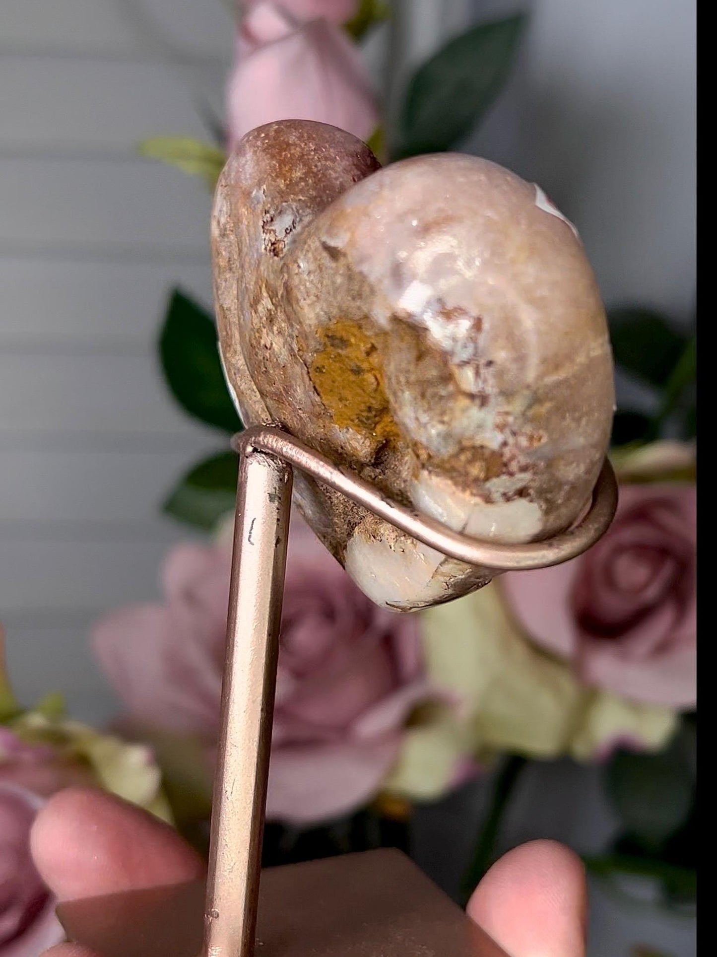 Beautiful, pink amethyst heart in a red tone with stand