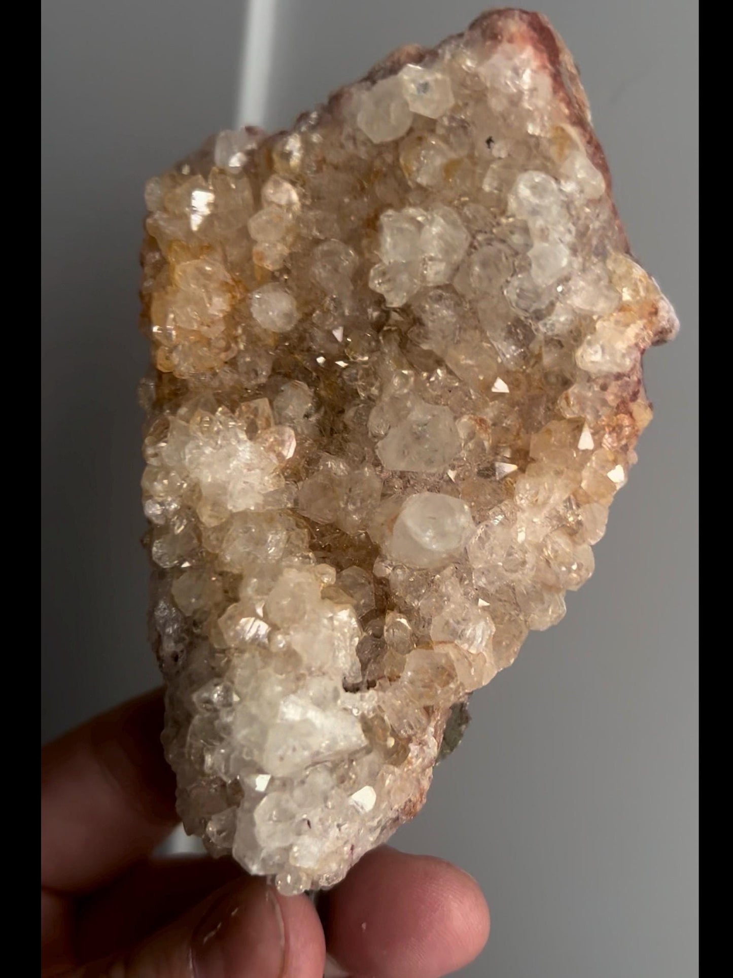High grade, pink amethyst geode on stand with high clarity quartz teeth