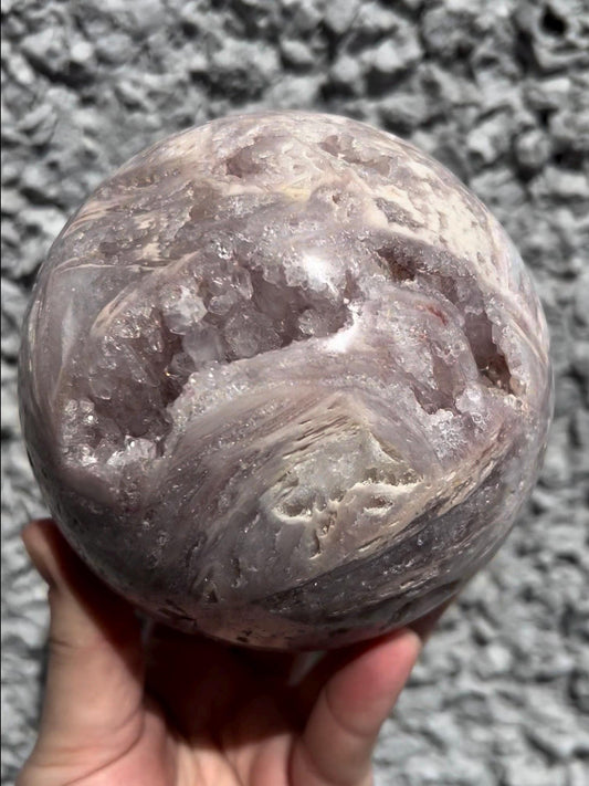 large, statement pink amethyst sphere with rutile formations in lilac tones over 1kg