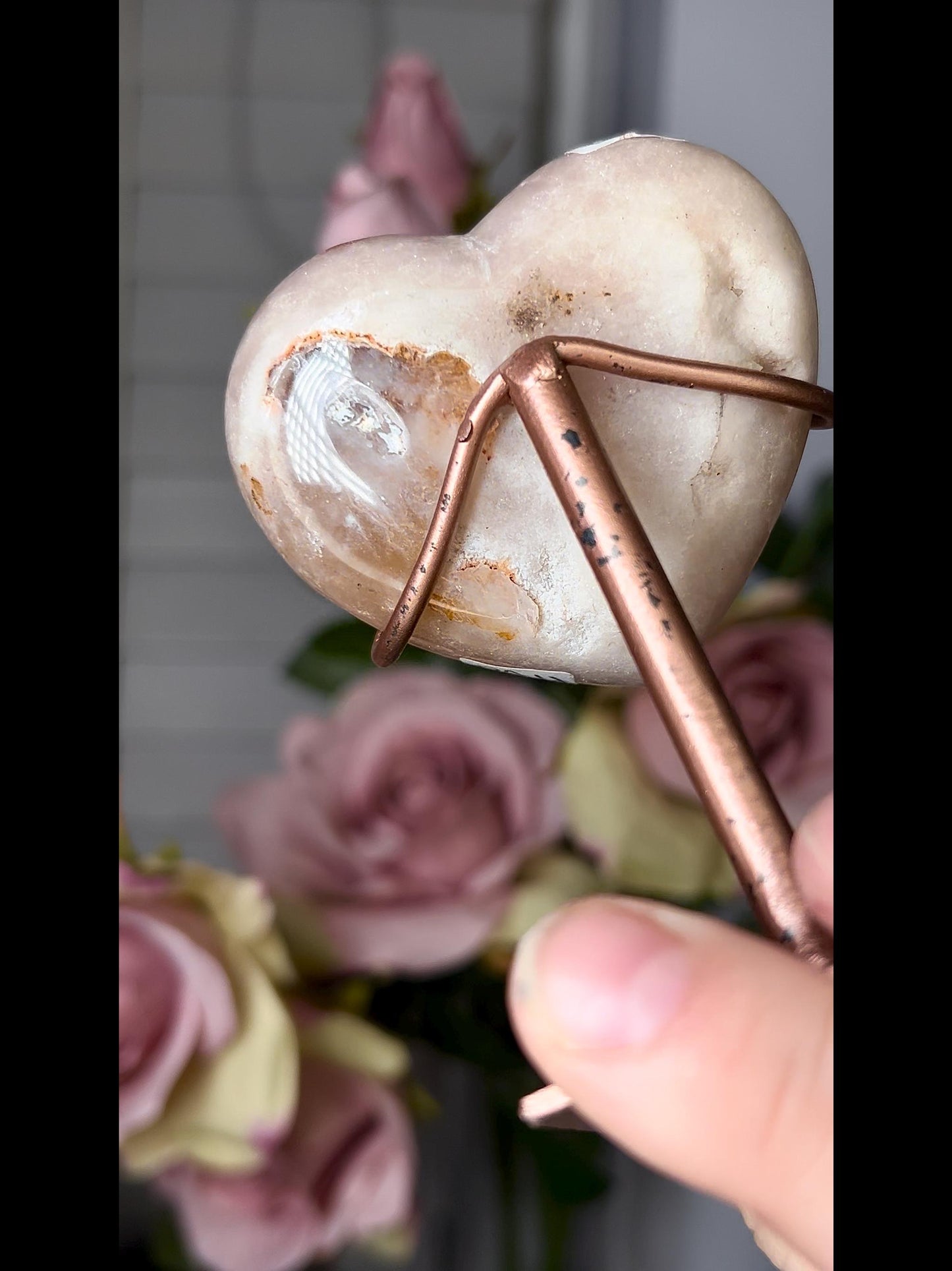 Beautiful, pink amethyst heart in peach tones with stand which has some scratches (discount added)