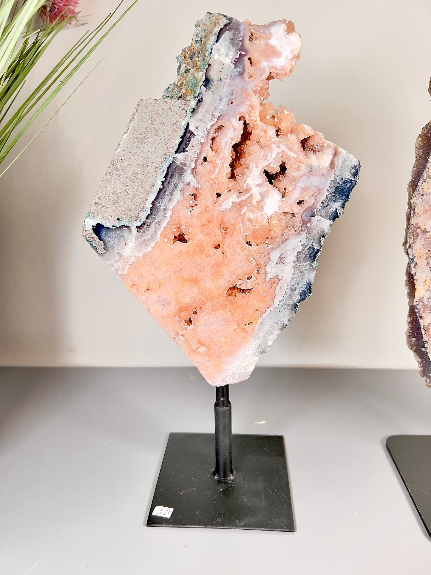 Gorgeous, peach, pink amethyst with smoky crystallisation and natural stone edging slab on turntable stand