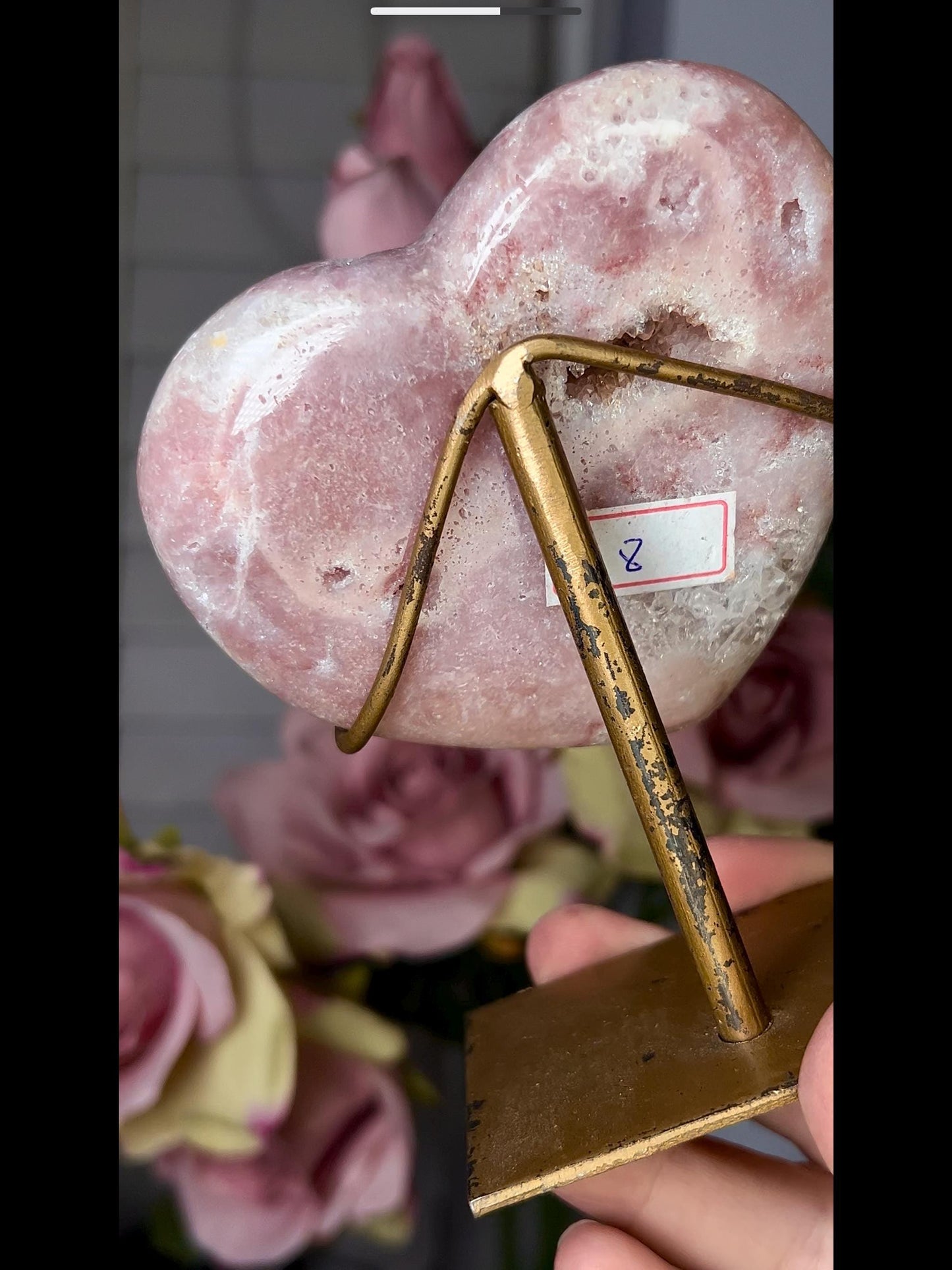 Beautiful, pink amethyst heart in peach tones with stand that is scratched (discount added)