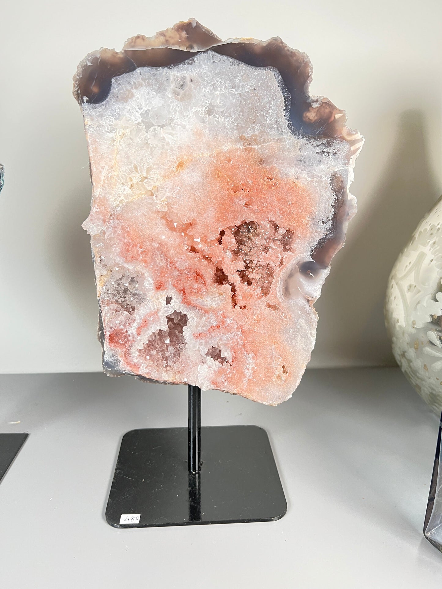 Peach, pink amethyst slab on stand  with smoky, clear and red crystallisation