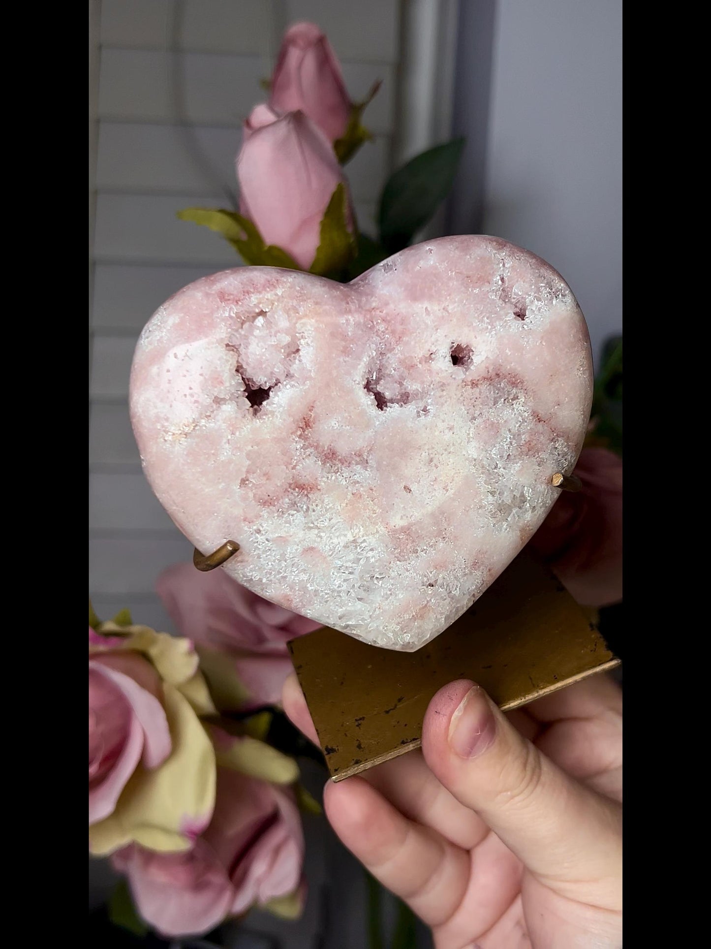 Beautiful, pink amethyst heart in peach tones with stand that is scratched (discount added)