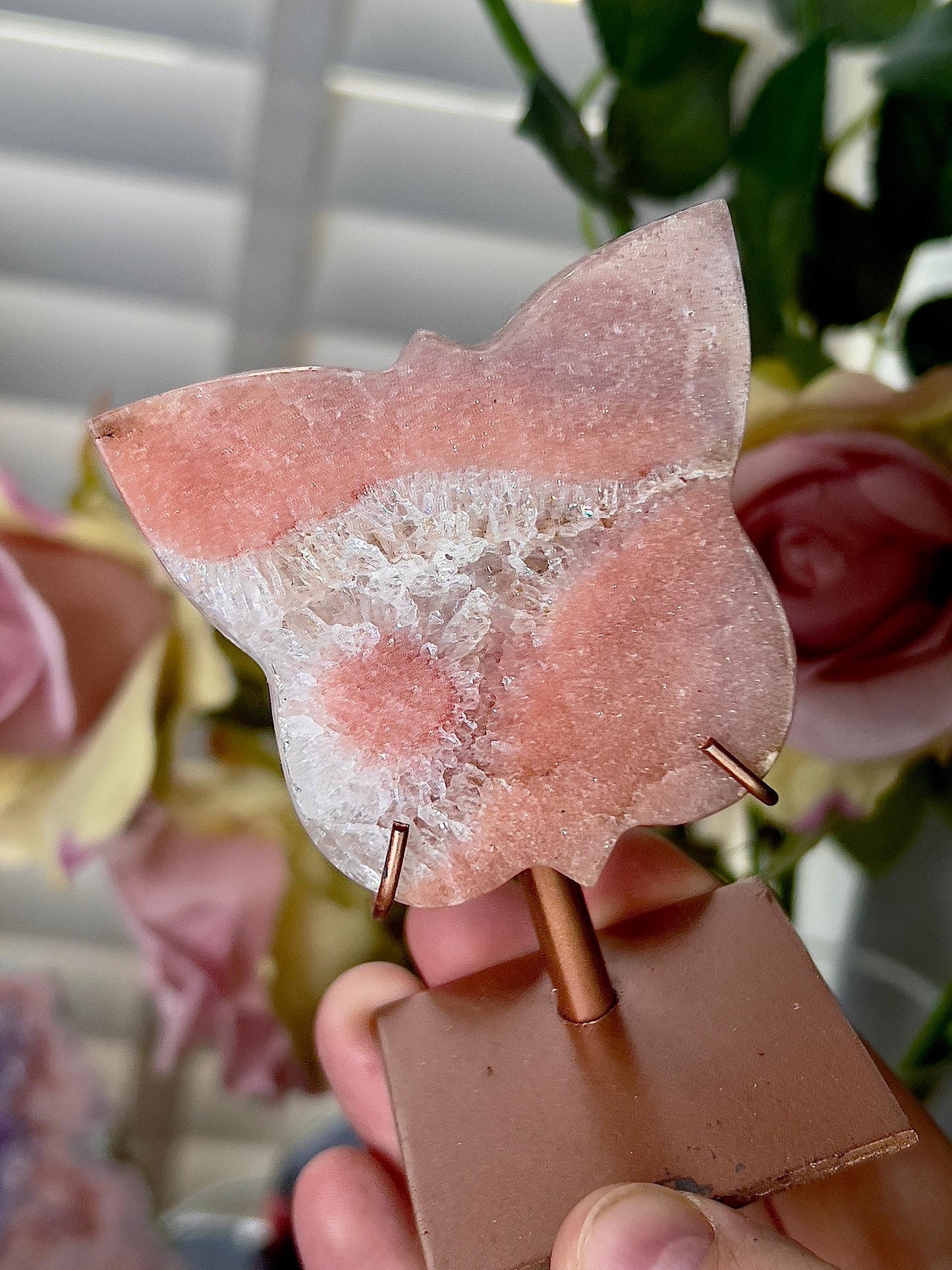 Pink amethyst butterfly in a peach tone with flower on stand