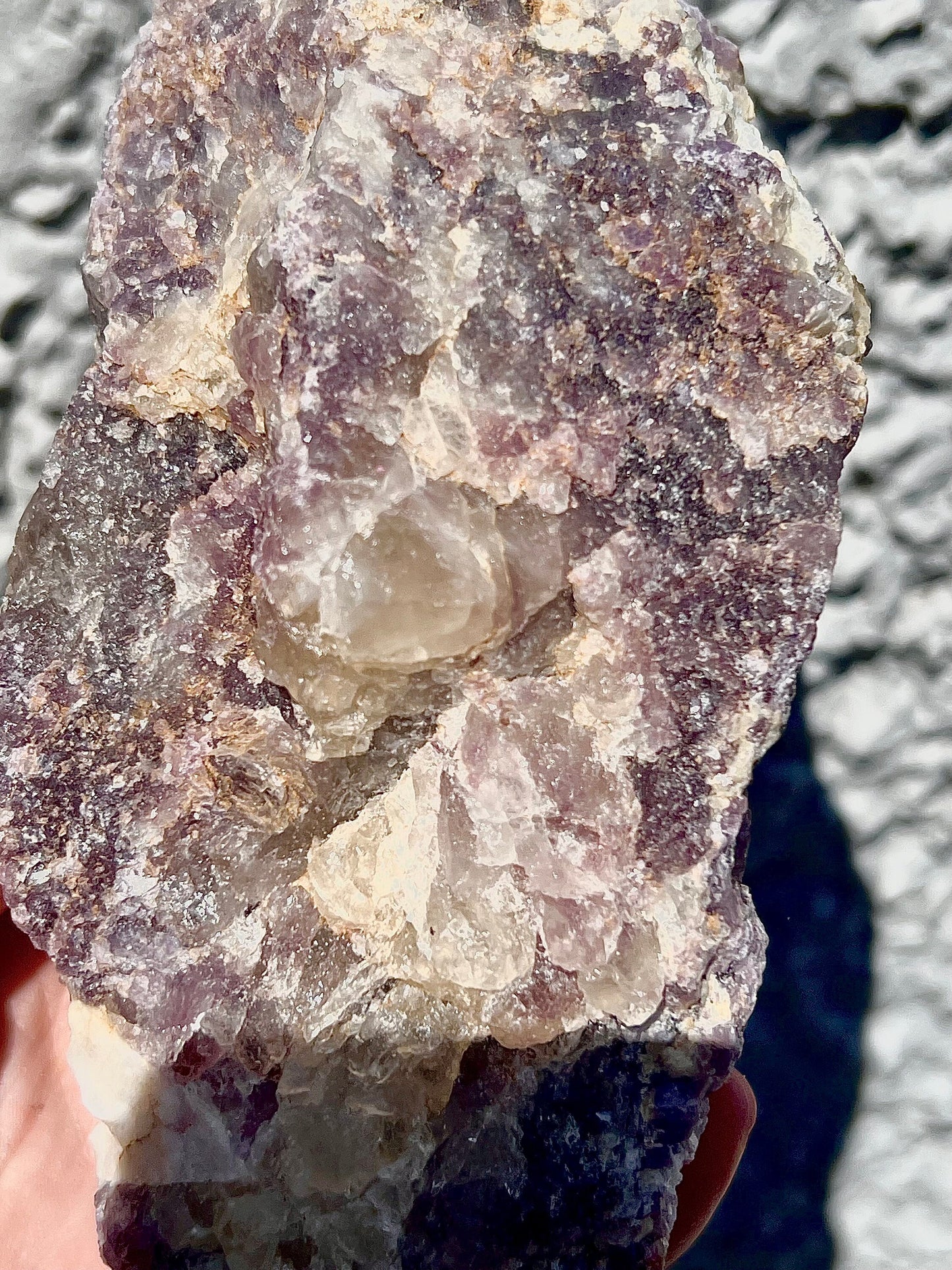 Rough lepidolite on stand