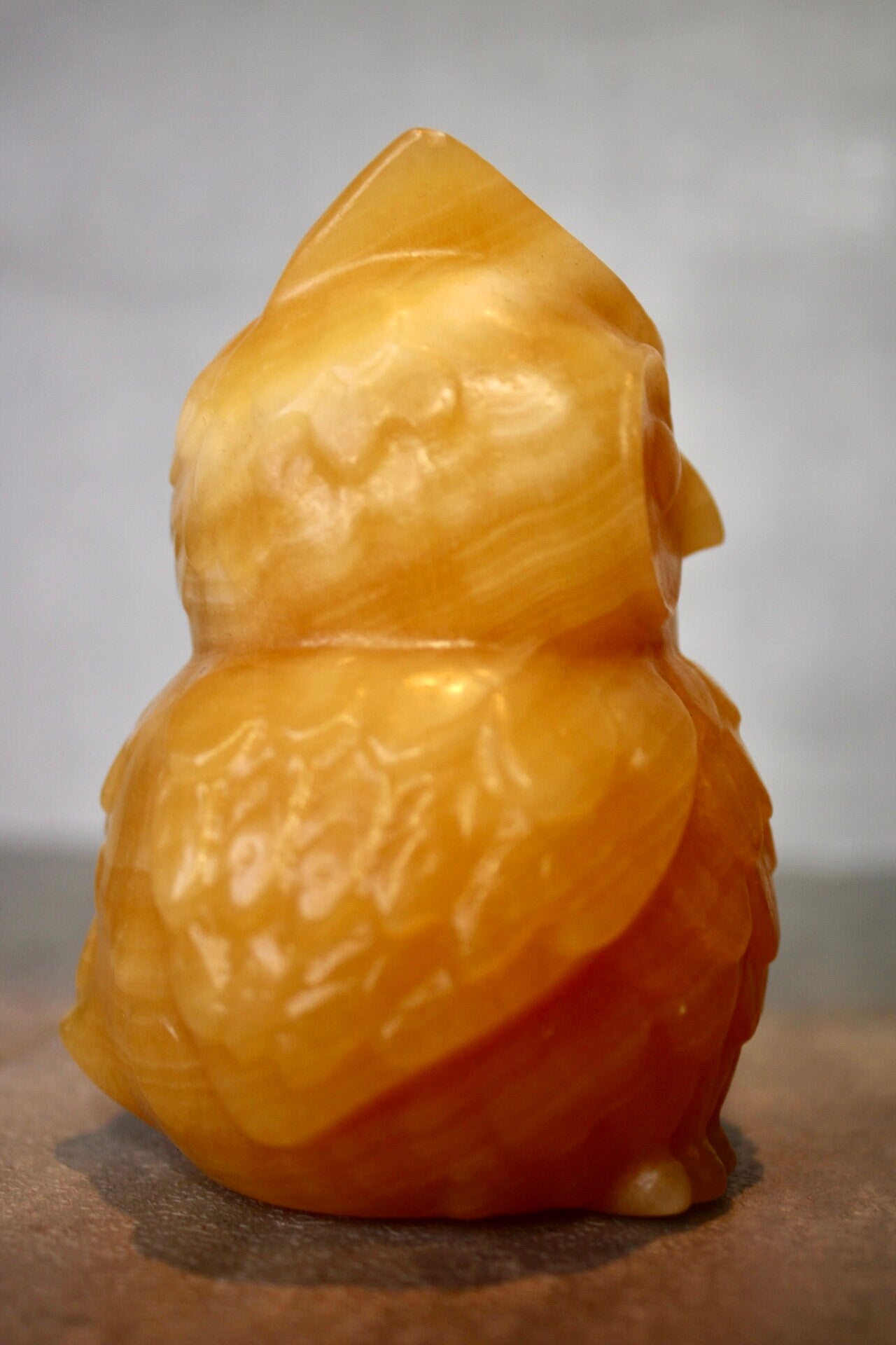 Large, orange calcite, owl carving 10cm(h) 8cm(w)