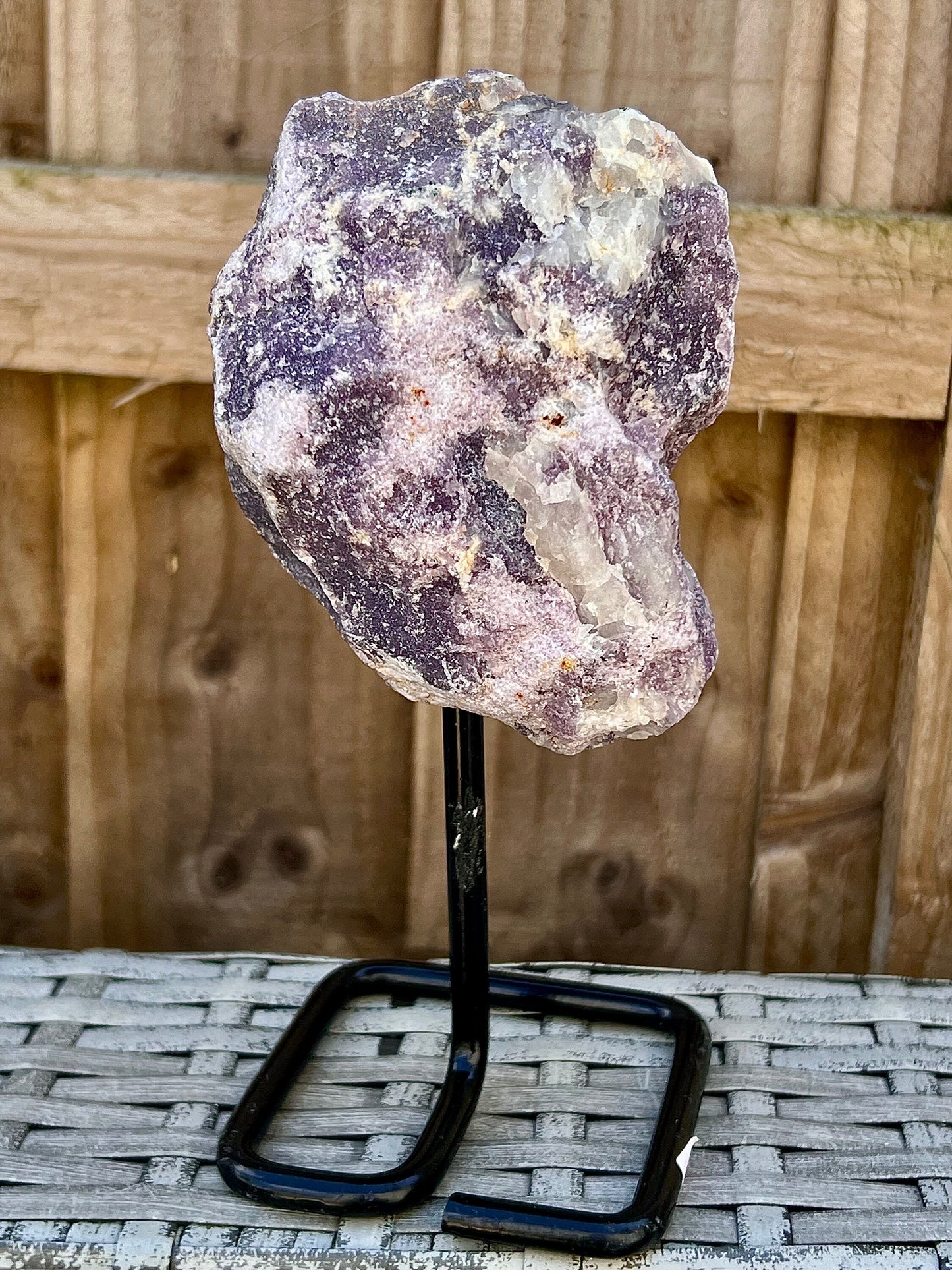 Rough lepidolite on stand
