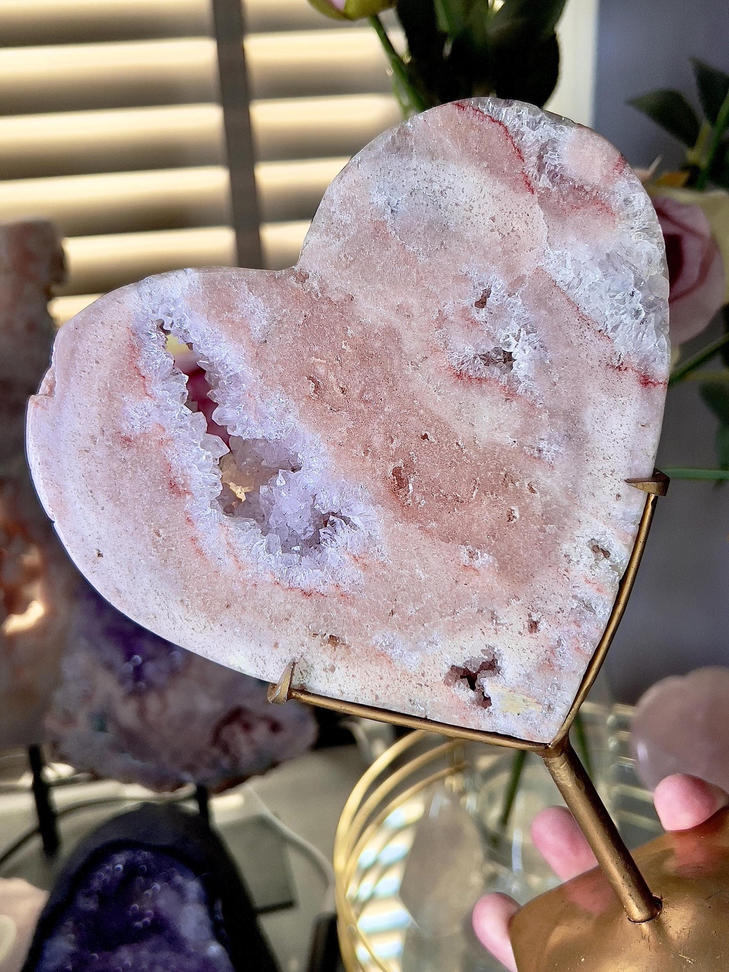 High quality, peach toned, pink amethyst heart with high drape quartz & red hematite lining on a custom gold stand 1.274kg