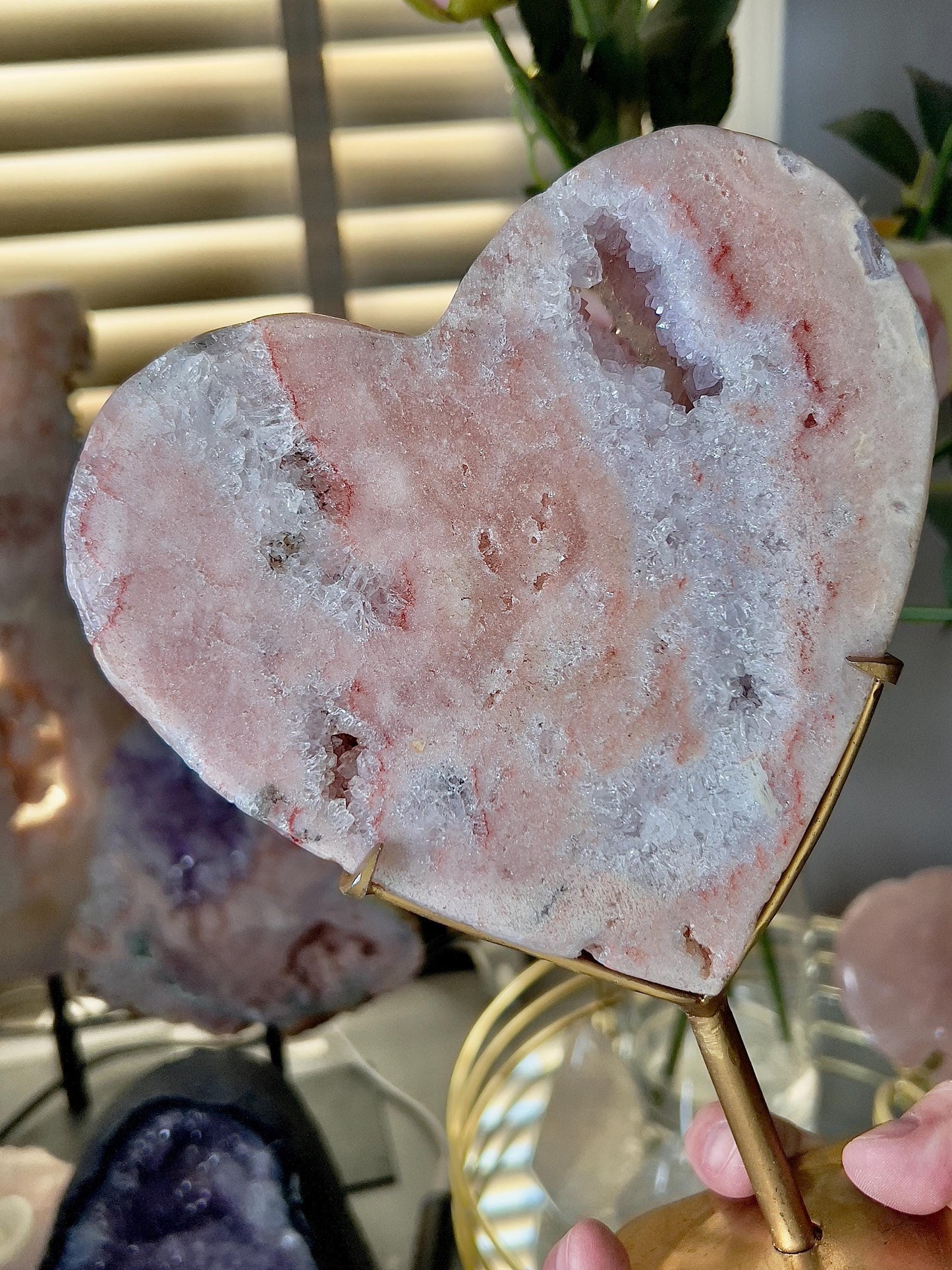 High quality, peach toned, pink amethyst heart with high drape quartz & red hematite lining on a custom gold stand 1.274kg