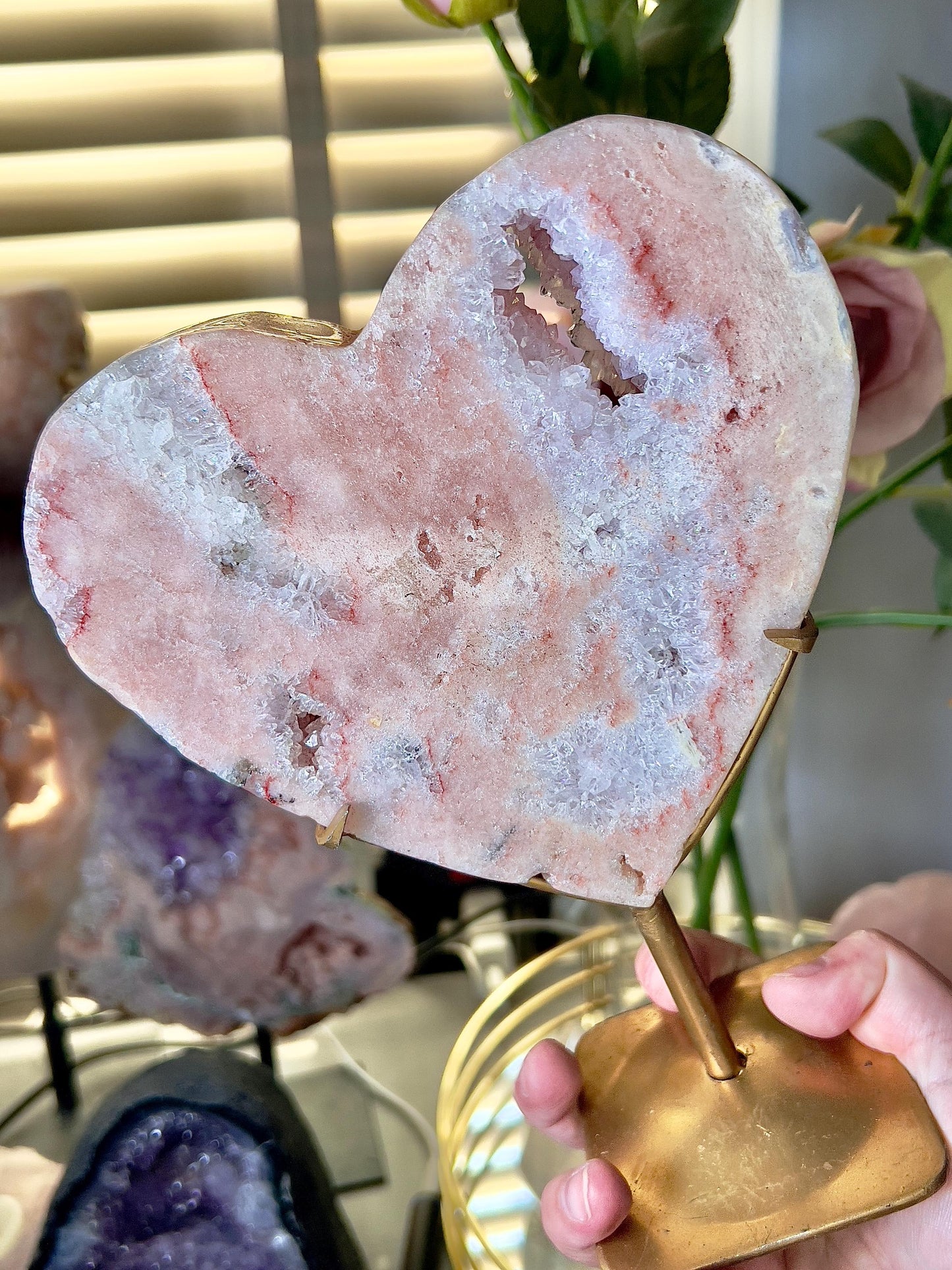 High quality, peach toned, pink amethyst heart with high drape quartz & red hematite lining on a custom gold stand 1.274kg
