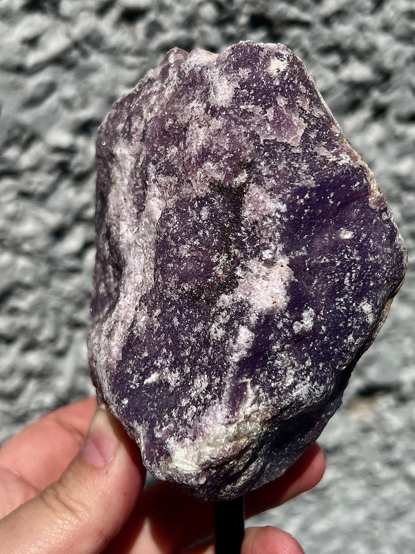 Rough lepidolite on stand