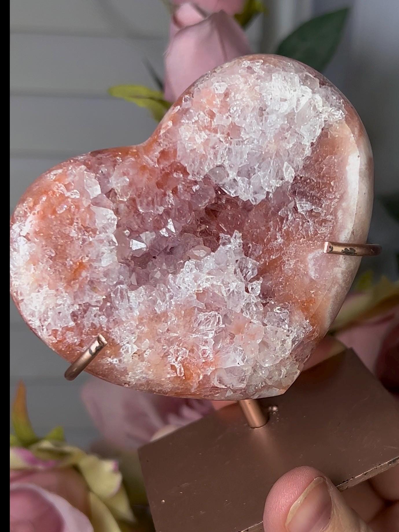 Beautiful, pink amethyst heart with vibrant red tone quartz, on stand
