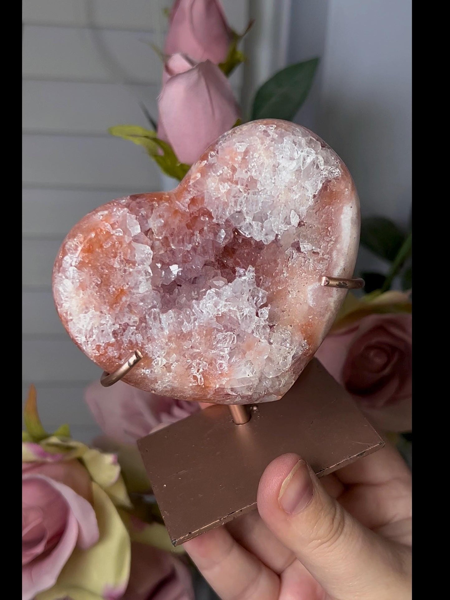 Beautiful, pink amethyst heart with vibrant red tone quartz, on stand