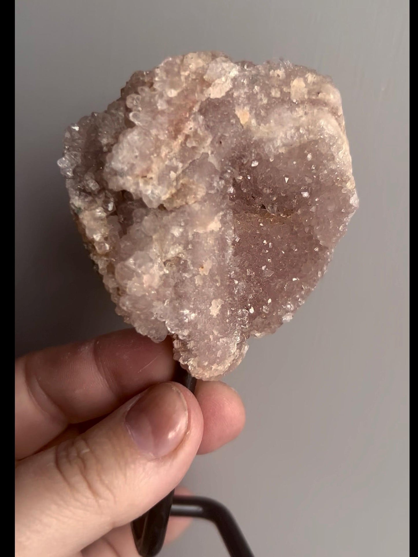 pink amethyst geode on stand