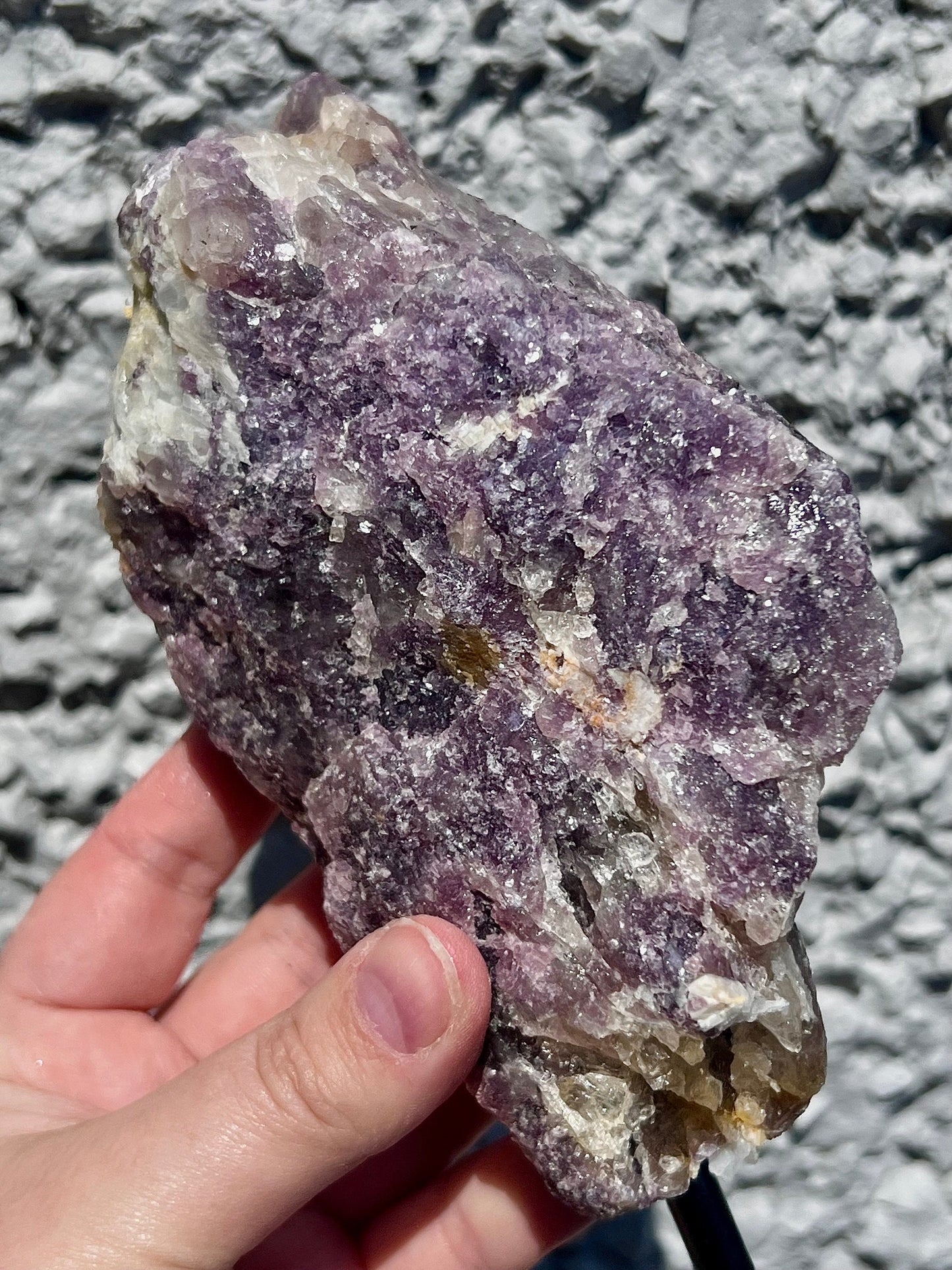 Rough lepidolite on stand