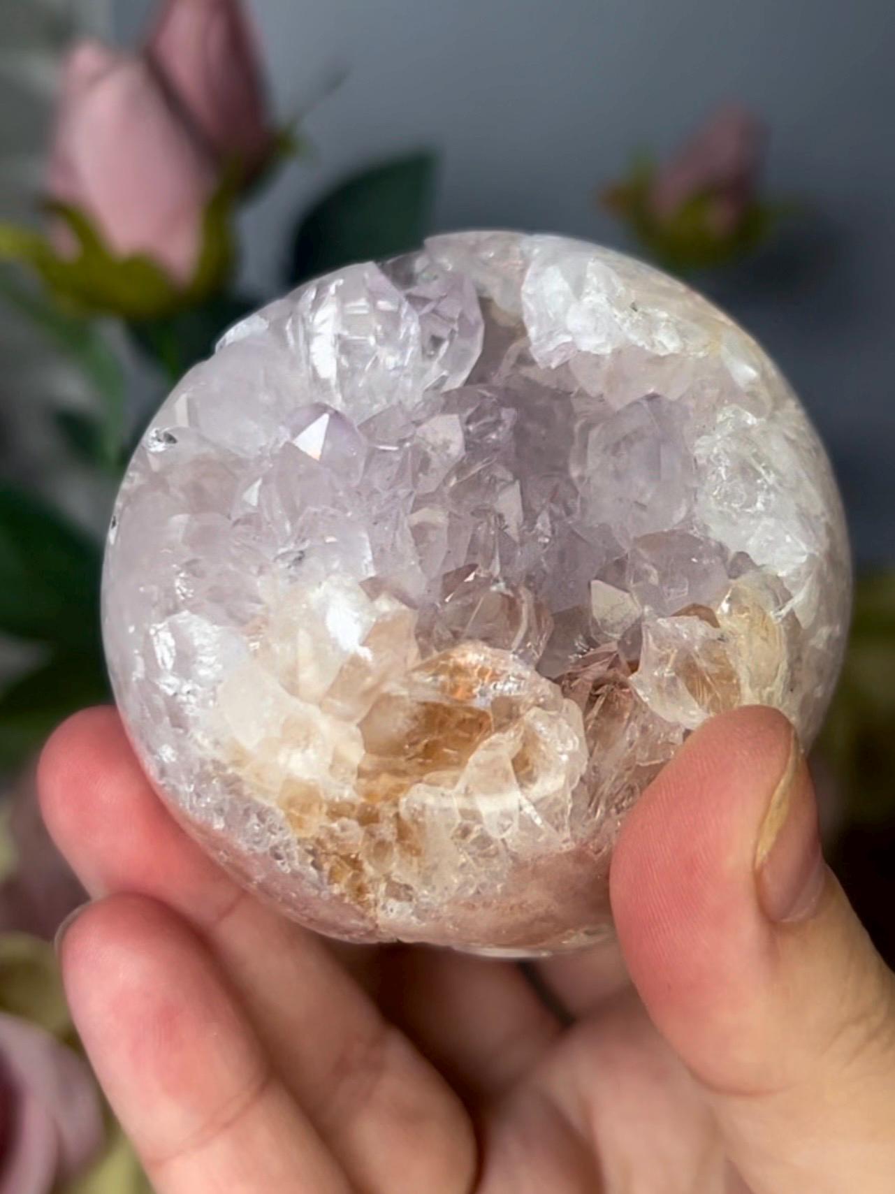 High grade, pink amethyst sphere with high clarity, rainbow, quartz teeth 429g