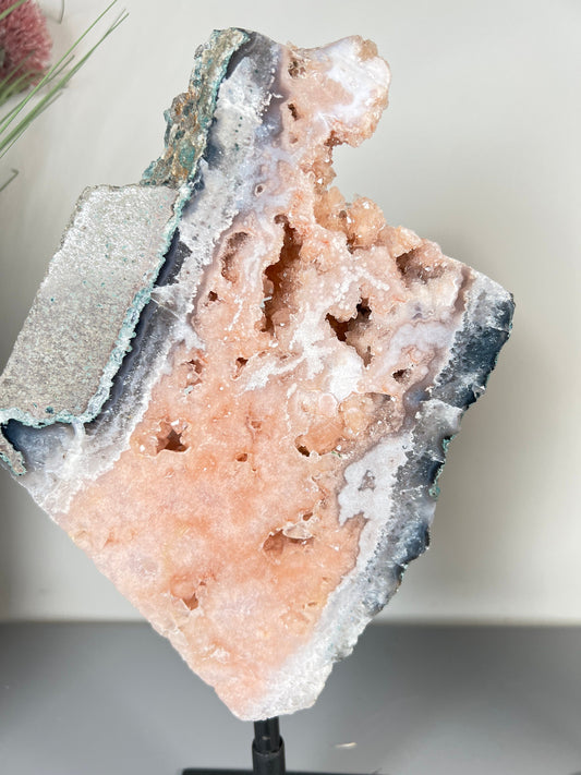 Gorgeous, peach, pink amethyst with smoky crystallisation and natural stone edging slab on turntable stand