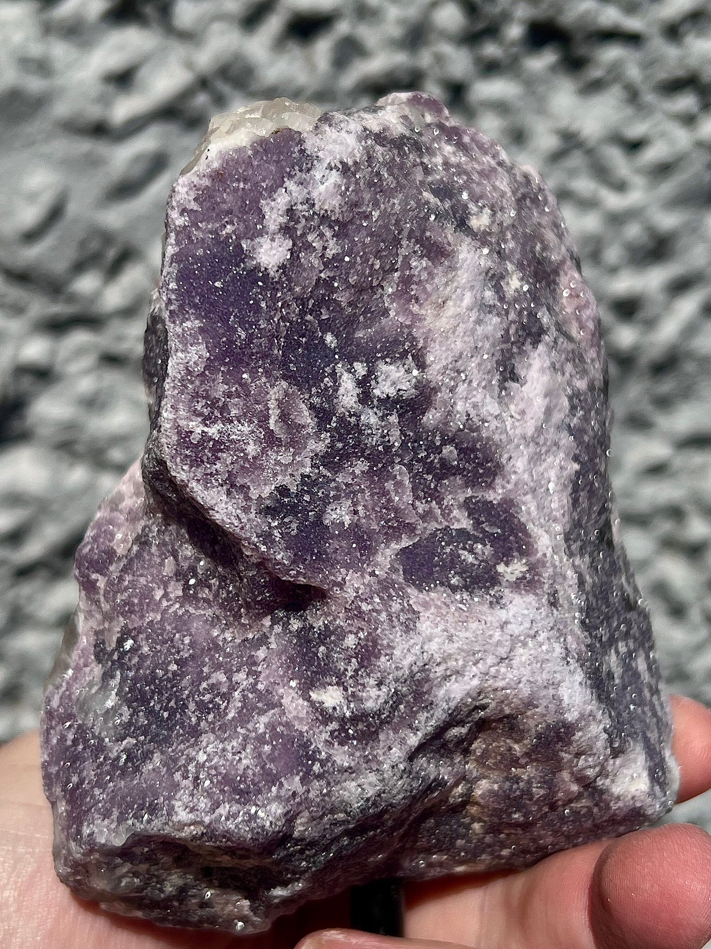 Rough lepidolite on stand