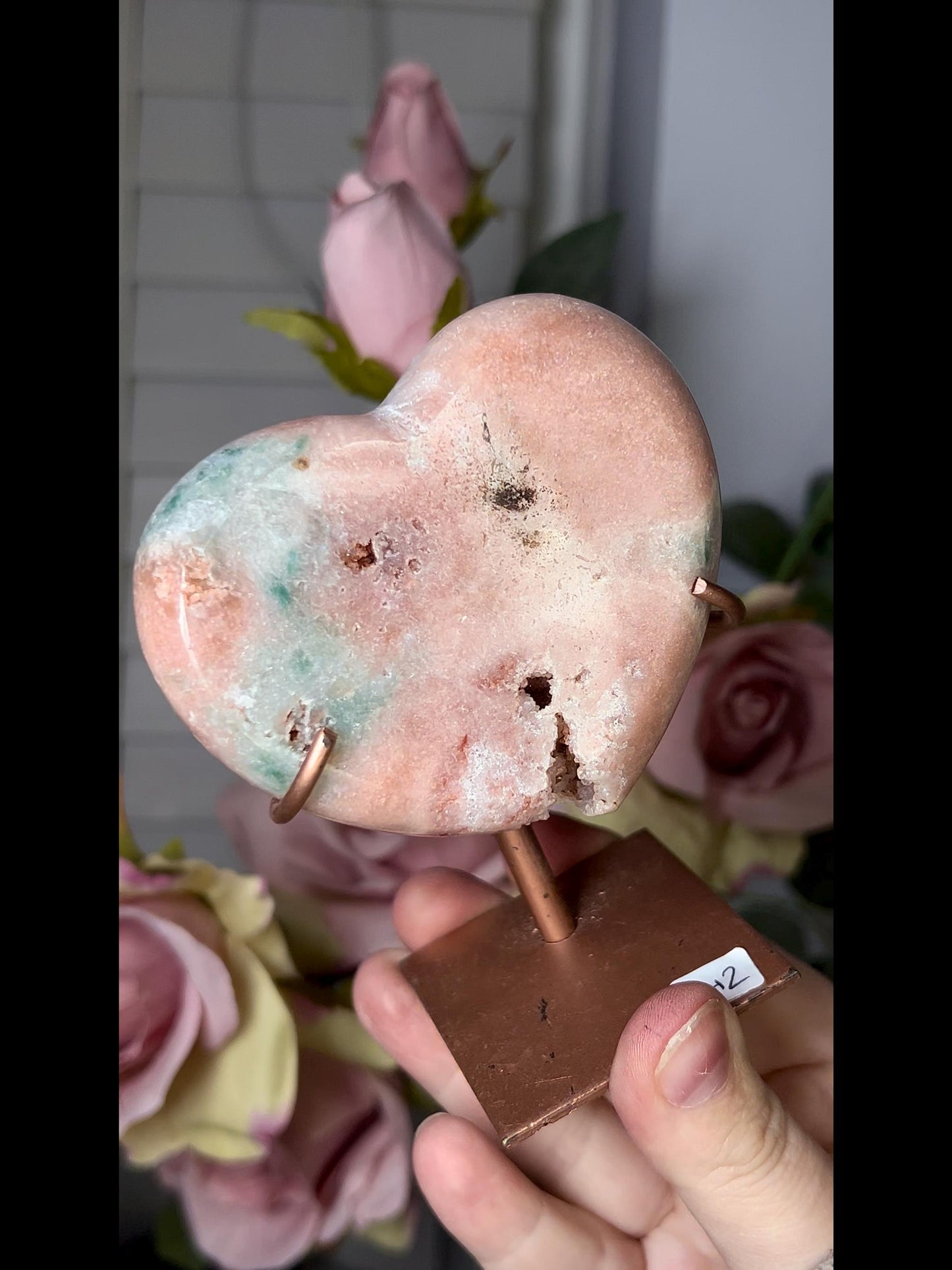 Beautiful, pink amethyst heart in peach tones with stand which has some scratches (discount added)