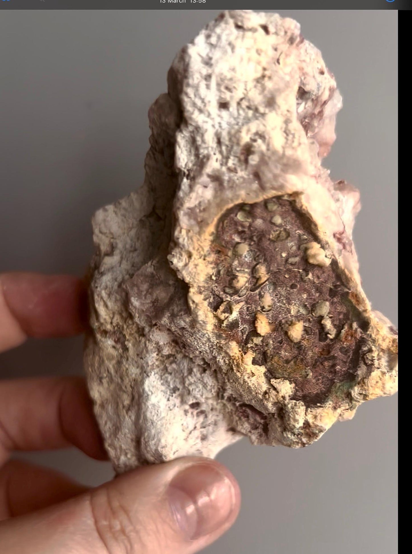 Pink amethyst geode on stand