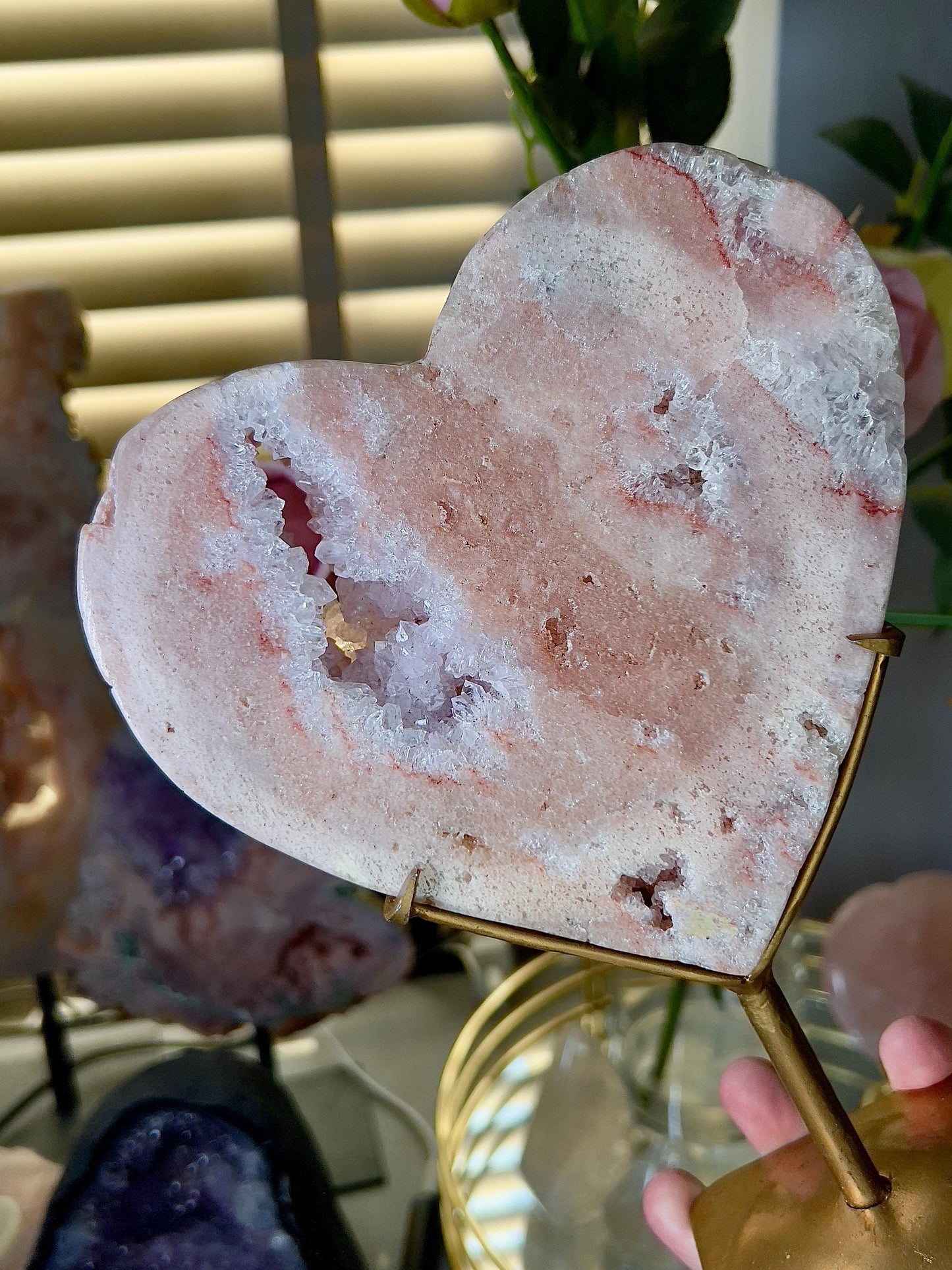 High quality, peach toned, pink amethyst heart with high drape quartz & red hematite lining on a custom gold stand 1.274kg