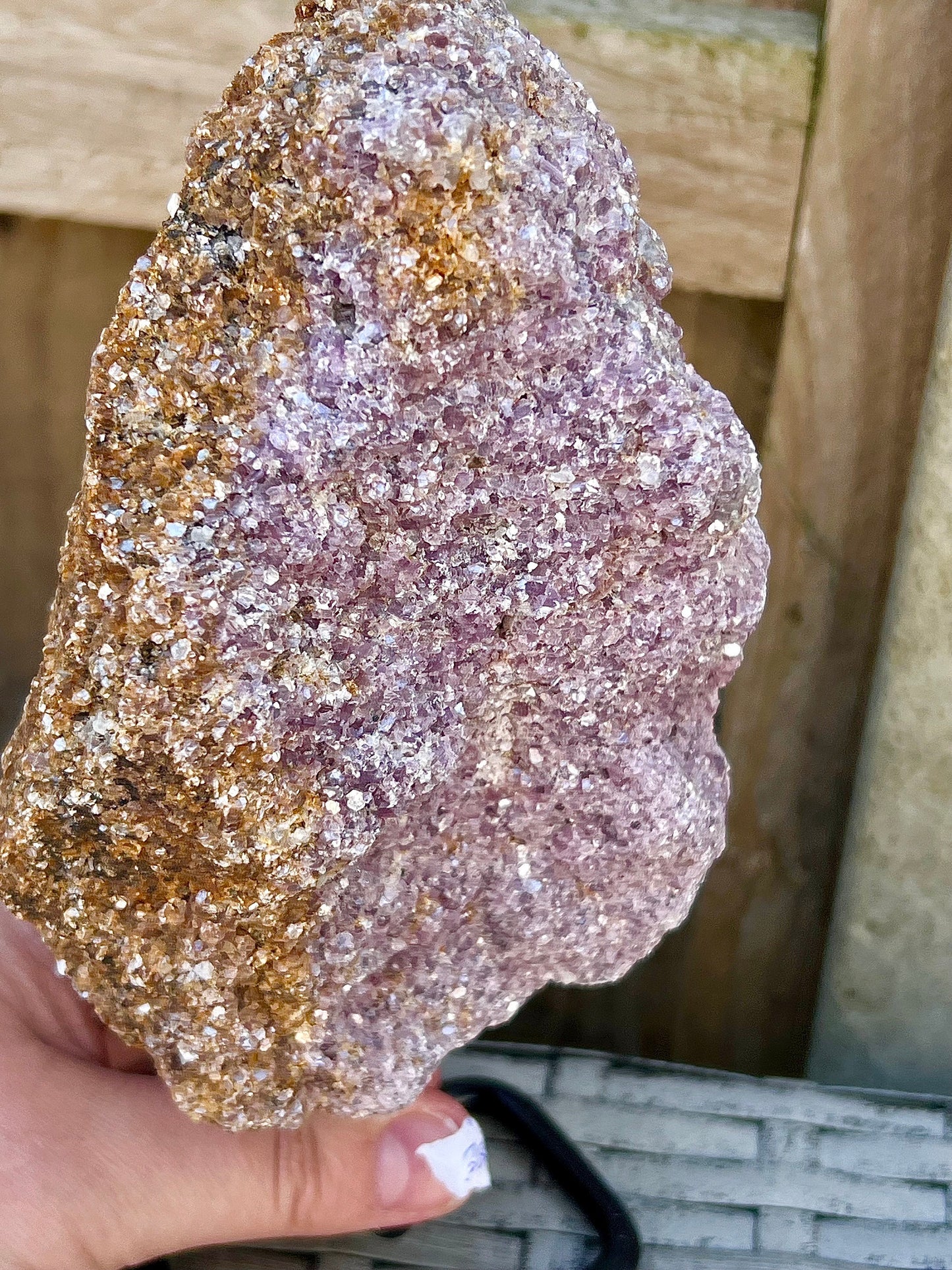 Rough lepidolite on stand