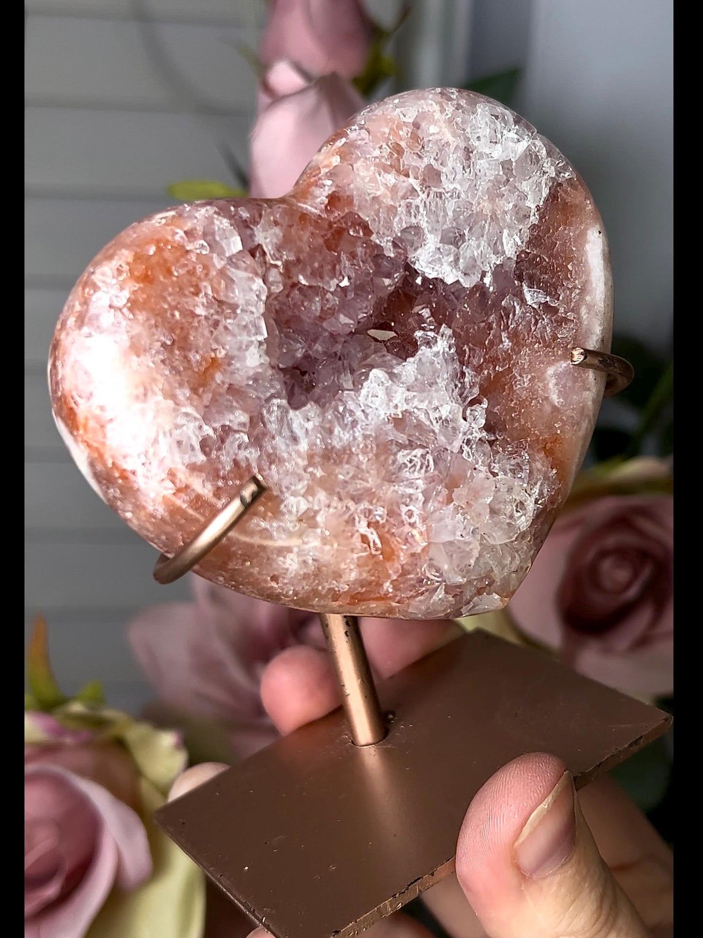 Beautiful, pink amethyst heart with vibrant red tone quartz, on stand