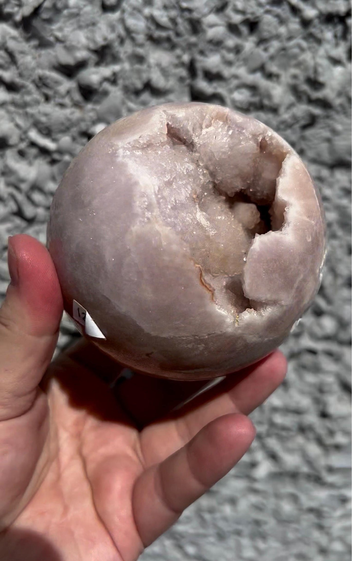 large, perfect baby pink amethyst sphere with sugar druzy cave and jasper 895g