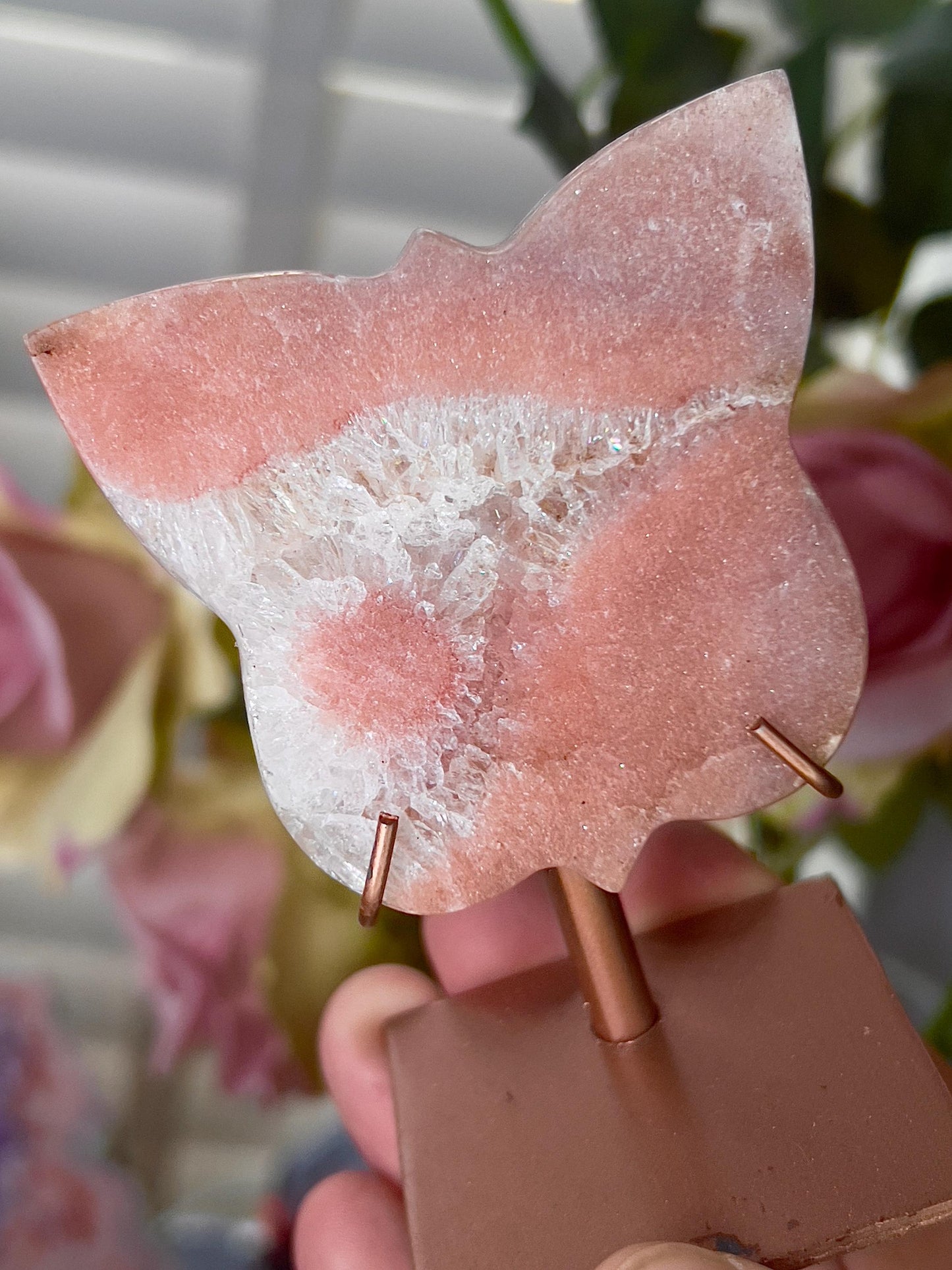 Pink amethyst butterfly in a peach tone with flower on stand