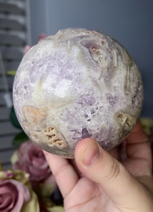 large, statement pink amethyst sphere with rutile formations and agate byover 1.220kg
