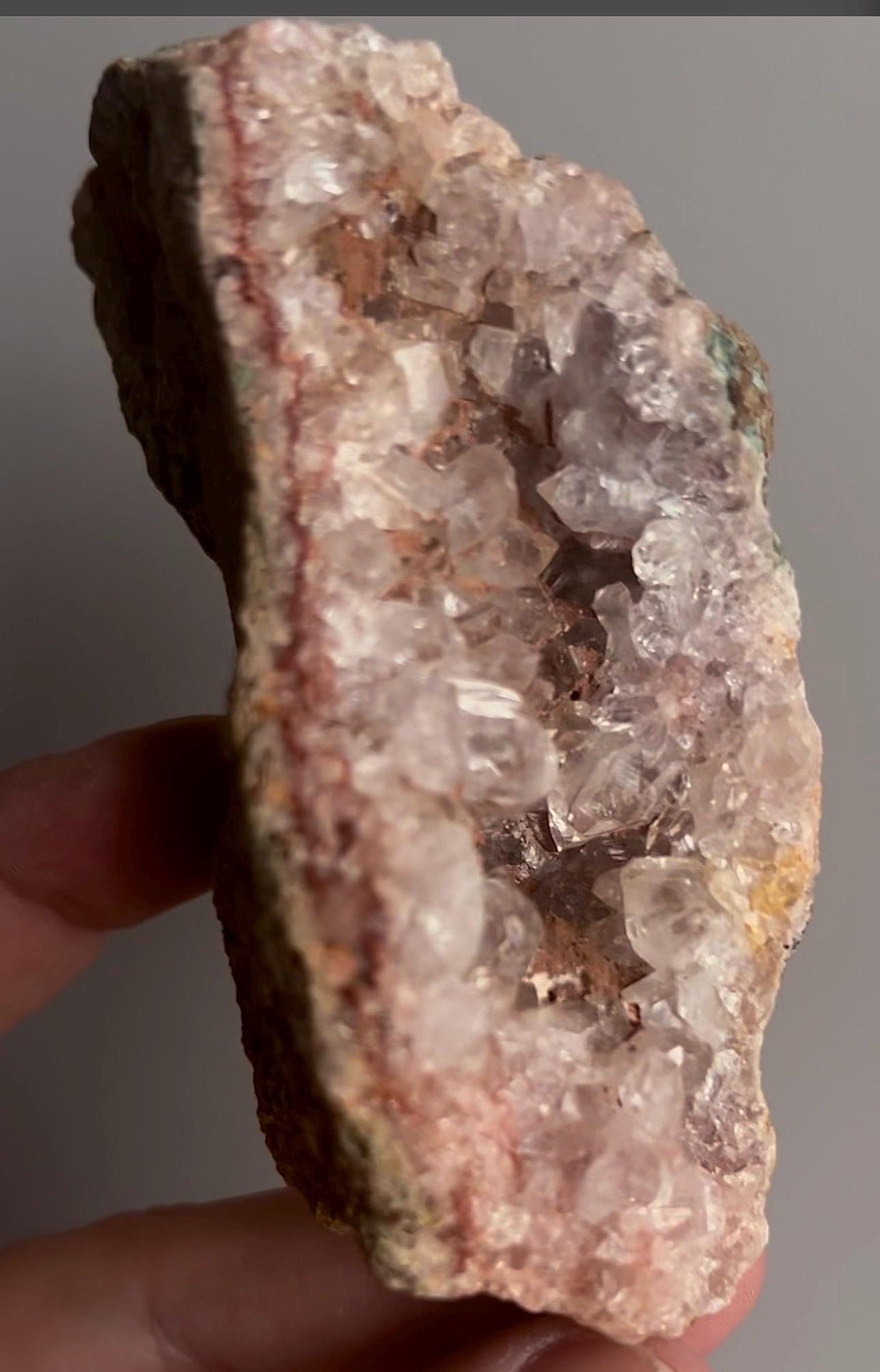 High grade, pink amethyst geode on stand quartz teeth