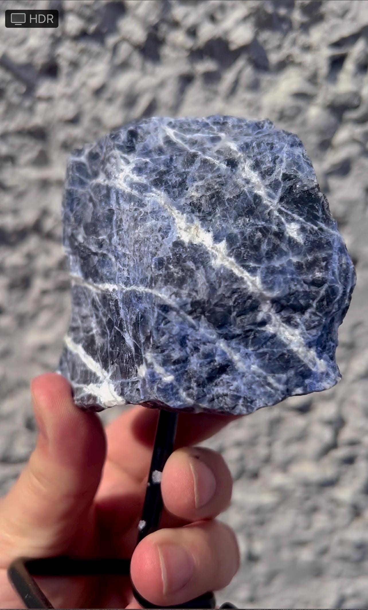 Rough Blue sodalite on stand