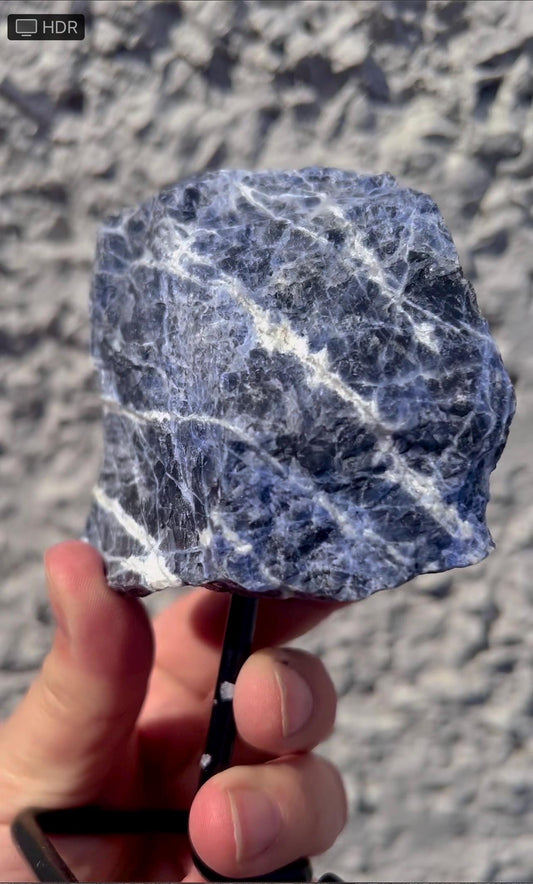 Rough Blue sodalite on stand