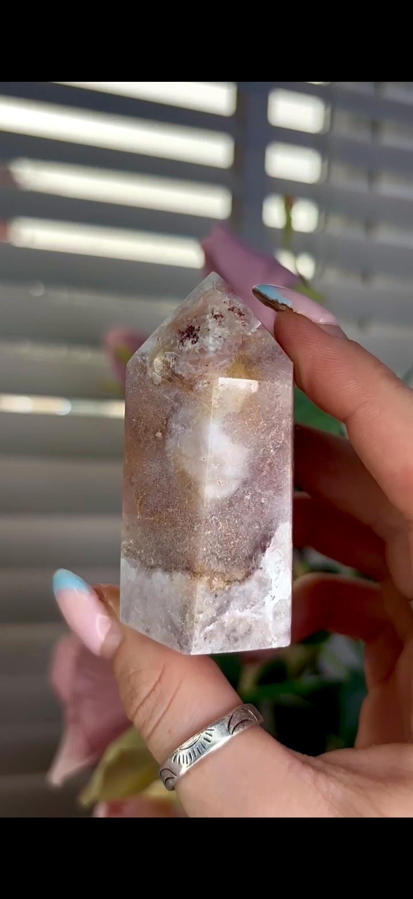 pink amethyst tower with bubble formation 128g 7cm by 4cm
