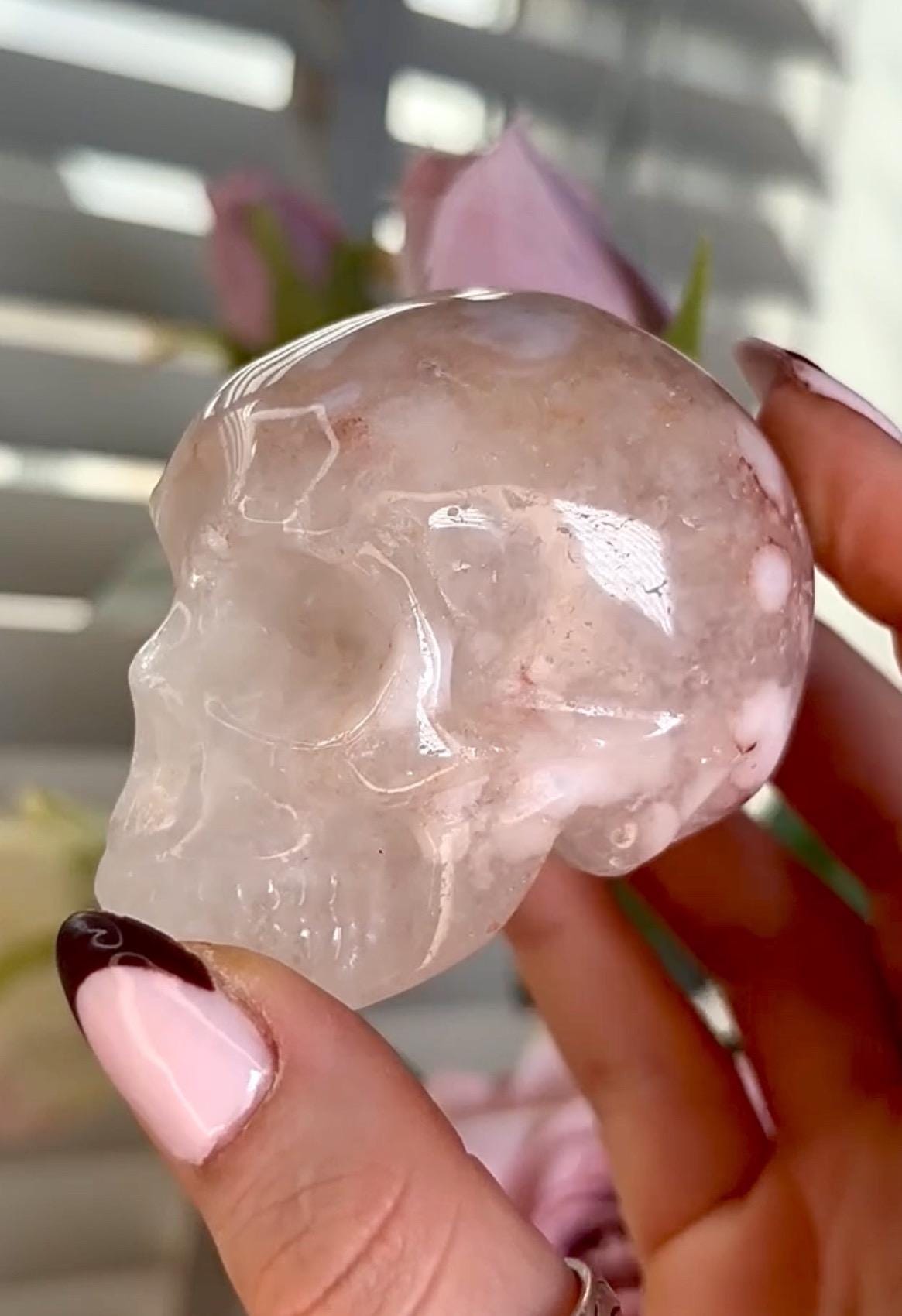 Flower agate skull in pink tones with red hematite lines