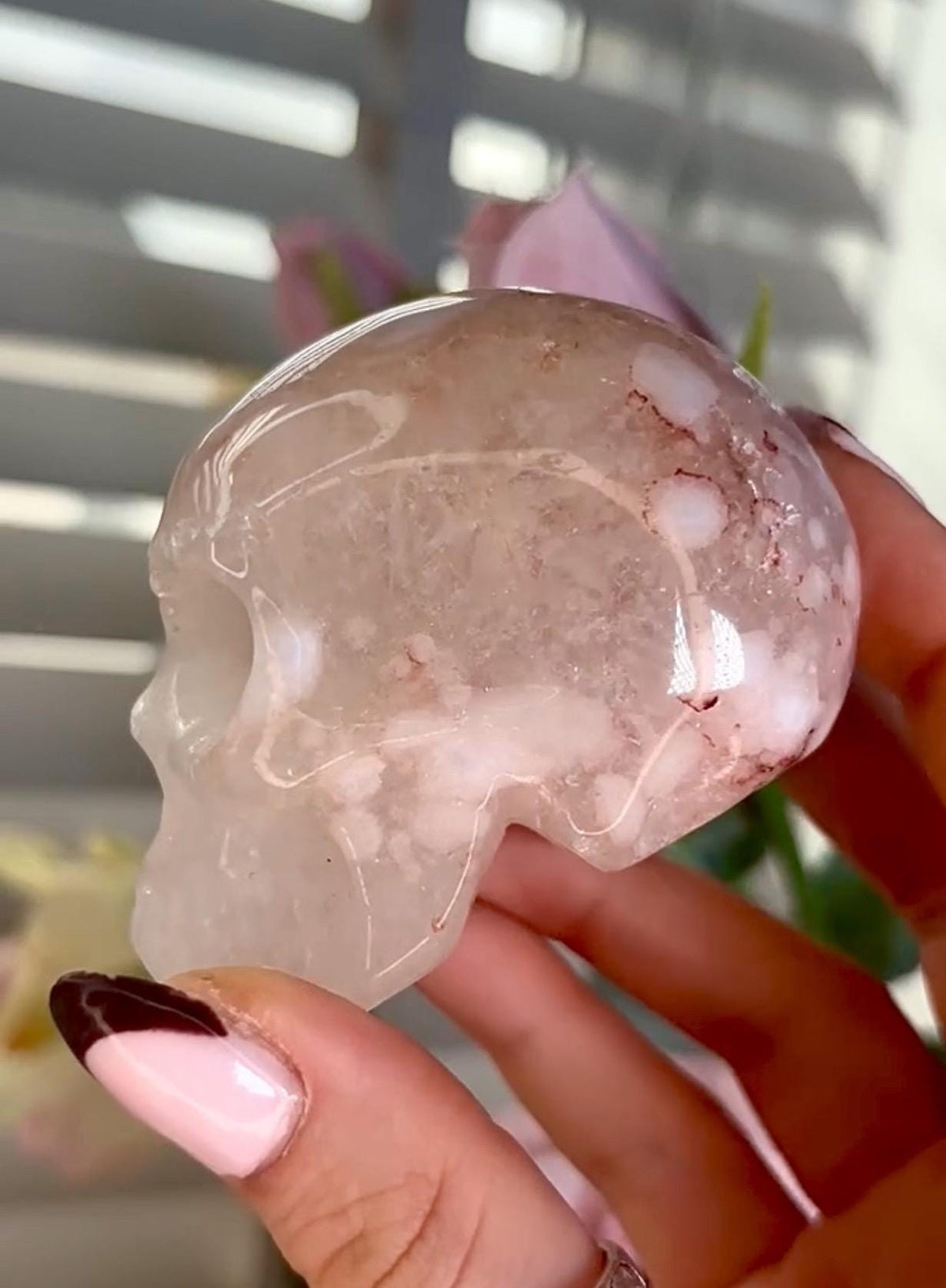 Flower agate skull in pink tones with red hematite lines