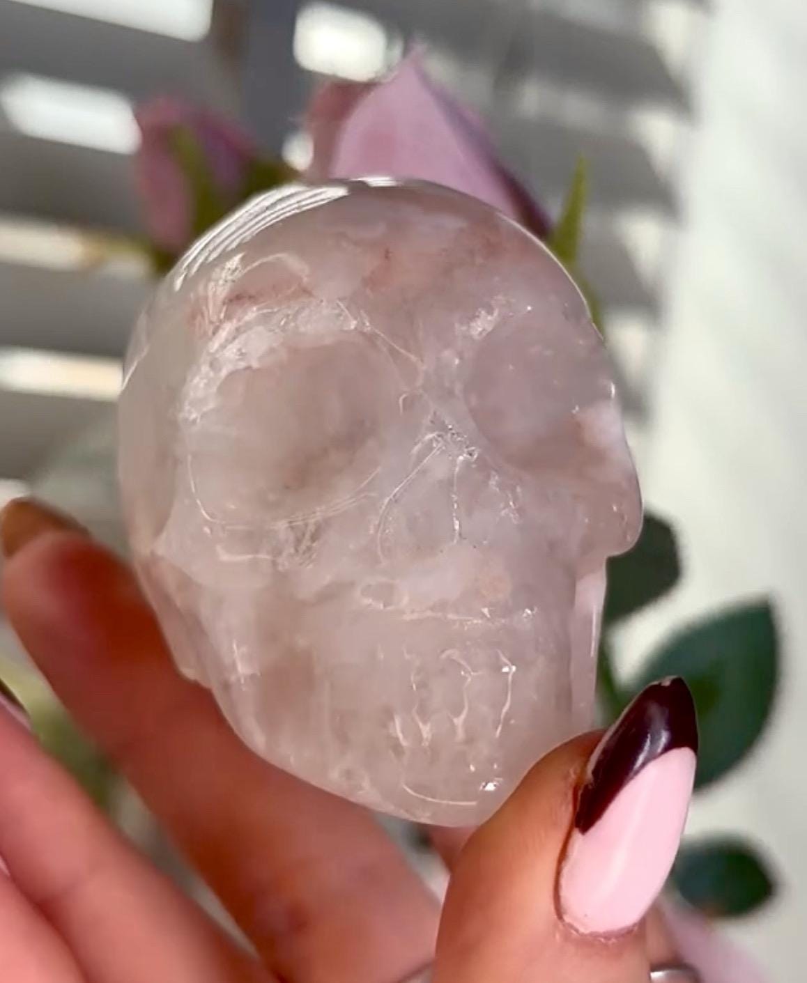 Flower agate skull in pink tones with red hematite lines