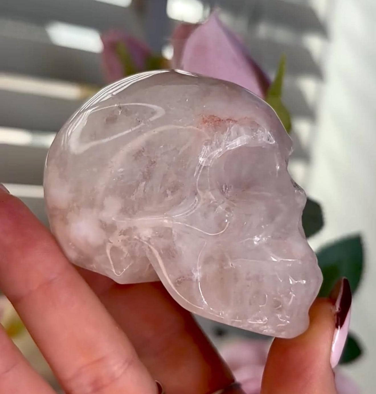 Flower agate skull in pink tones with red hematite lines