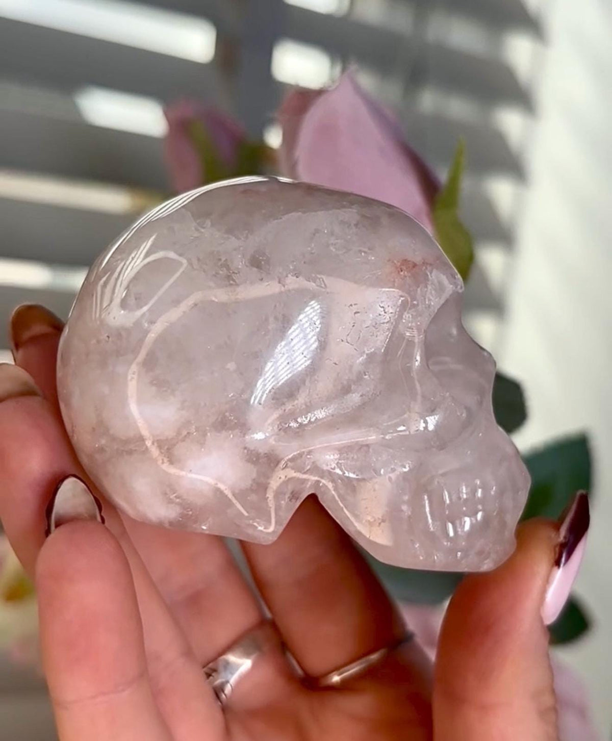 Flower agate skull in pink tones with red hematite lines