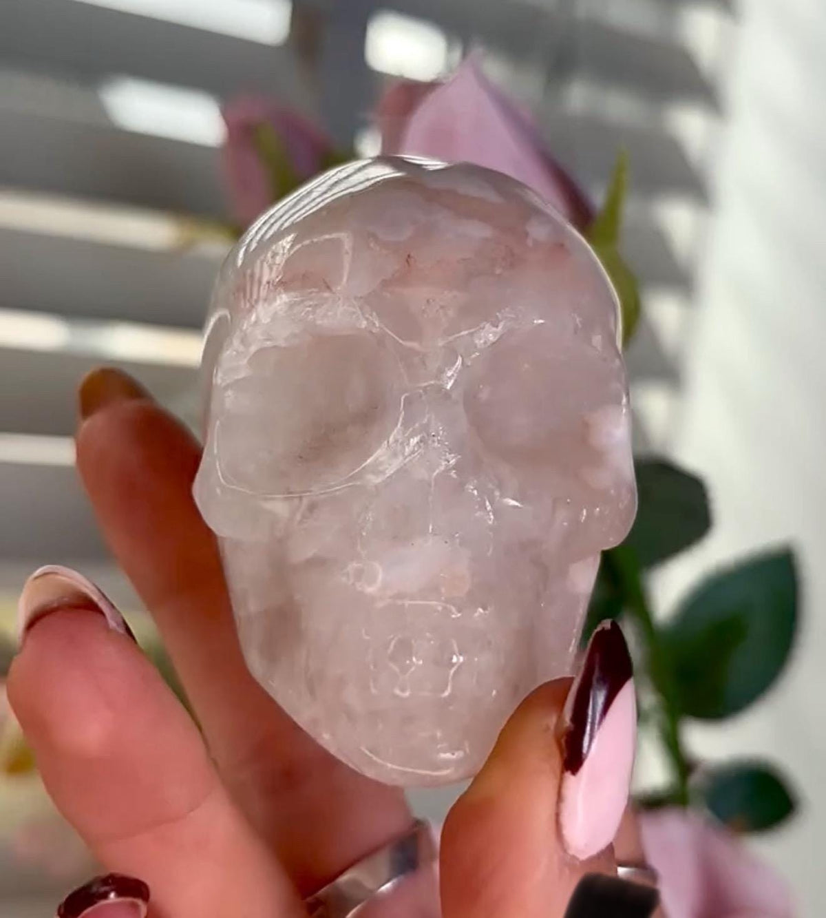 Flower agate skull in pink tones with red hematite lines