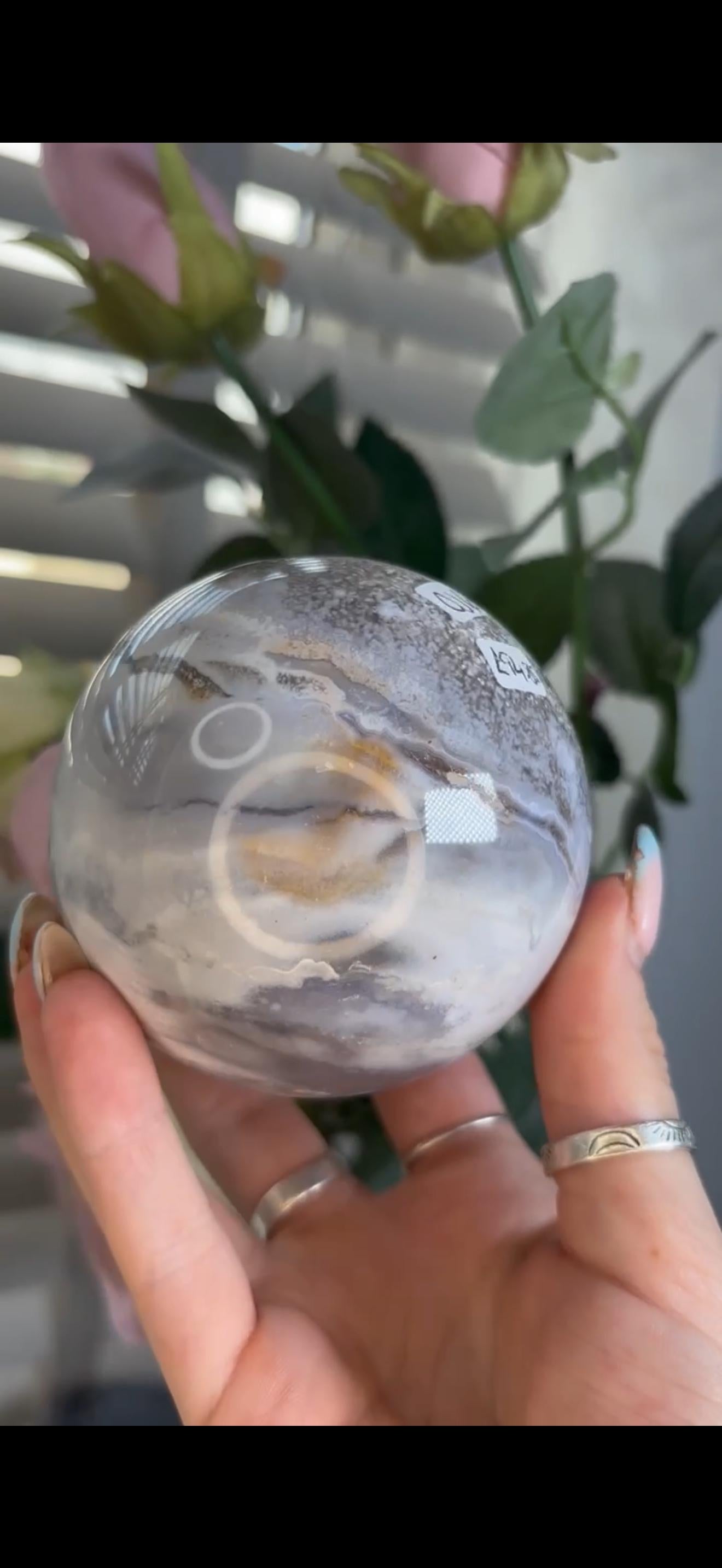 Pastel ocean jasper sphere in baby blue, white & dark blue tones with quartz