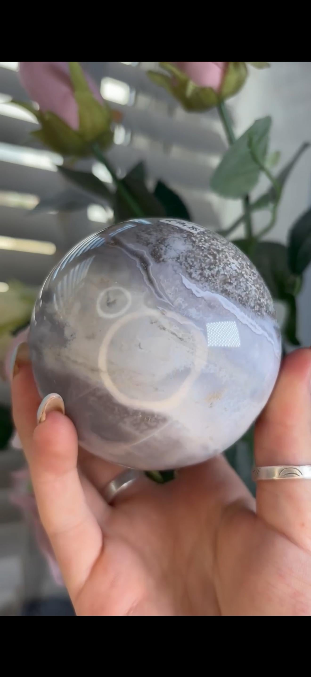 Pastel ocean jasper sphere in baby blue, white & dark blue tones with quartz
