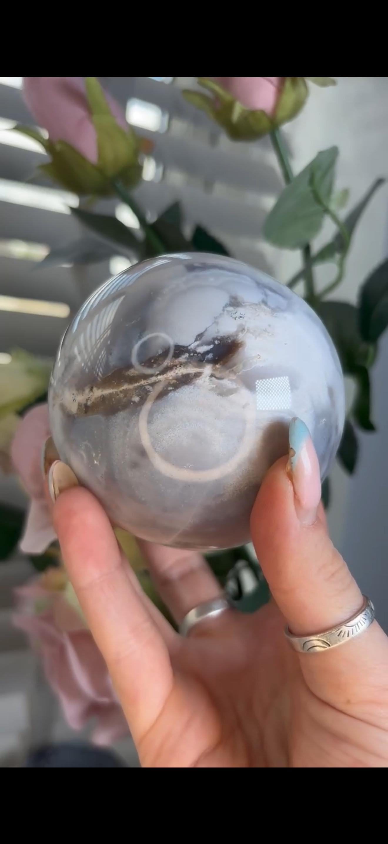 Pastel ocean jasper sphere in baby blue, white & dark blue tones with quartz